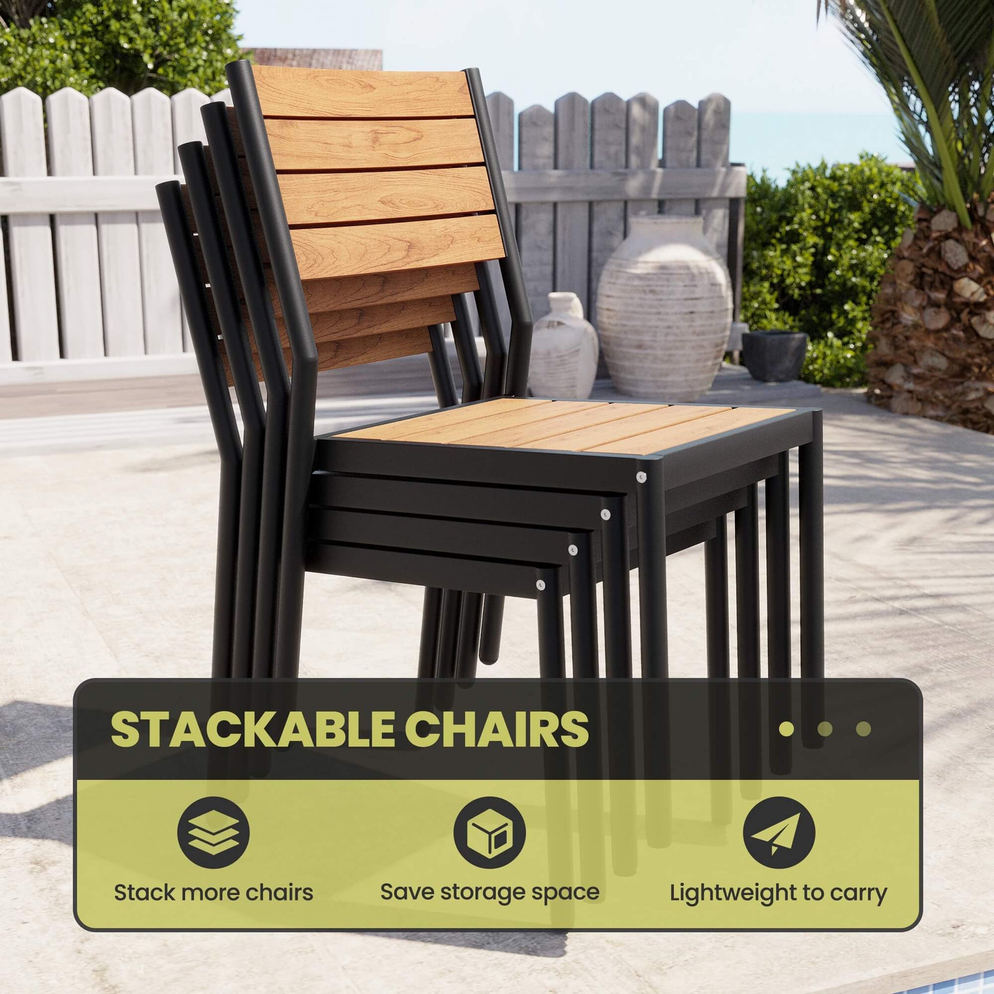 Stacked armless outdoor patio dining chairs with teak polywood slatted backs on backyard patio.