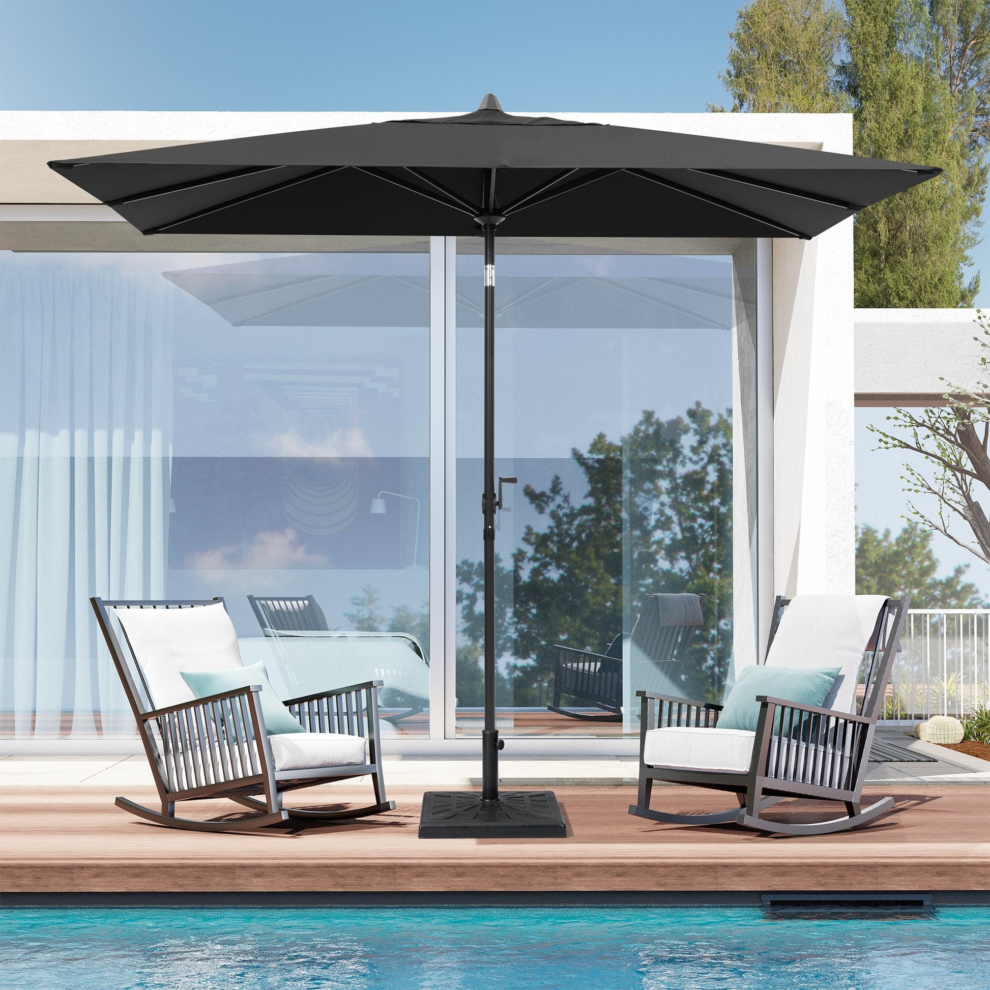 9x5 ft black aluminum rectangular market umbrella shading two patio rocking chairs by a poolside deck.