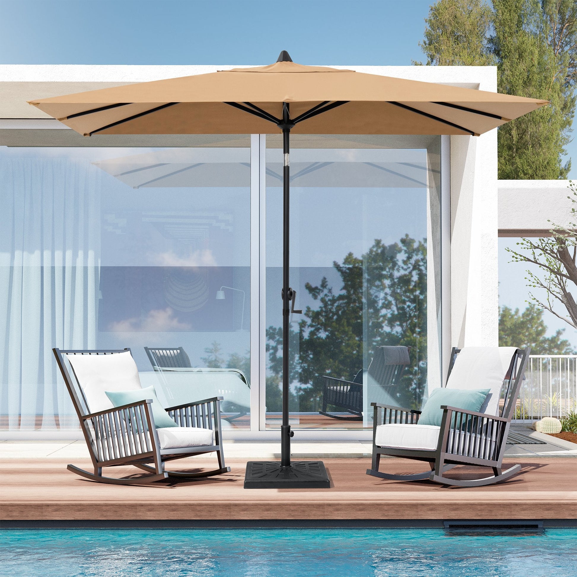 9x5 ft tan aluminum rectangular market umbrella shading two patio rocking chairs by a poolside deck.