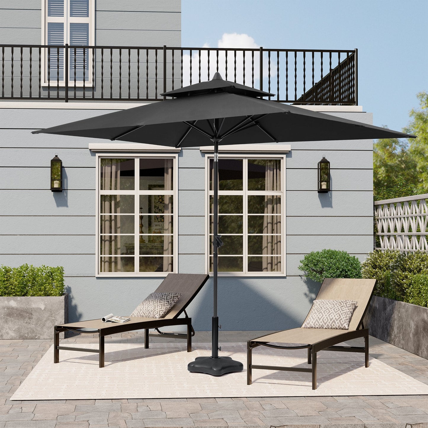 9x5 ft black rectangular market umbrella with double top shading two patio lounge chairs on a backyard patio.