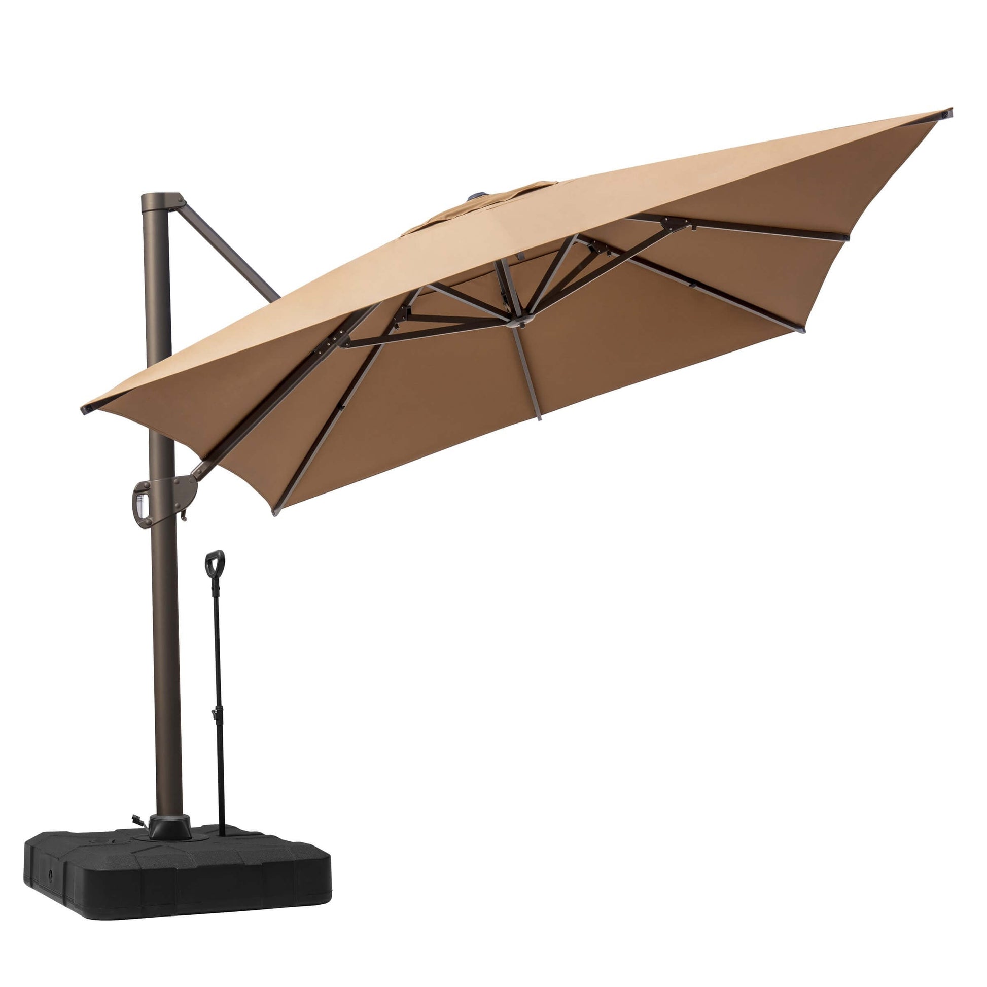 Tilted tan square cantilever patio umbrella on a heavy-duty black base with adjustment pole on white background.