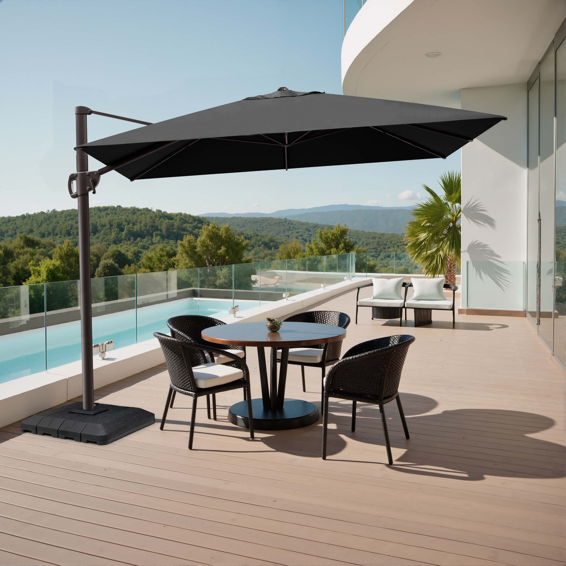 Black rectangular cantilever umbrella with weighted base shading a poolside patio dining set.