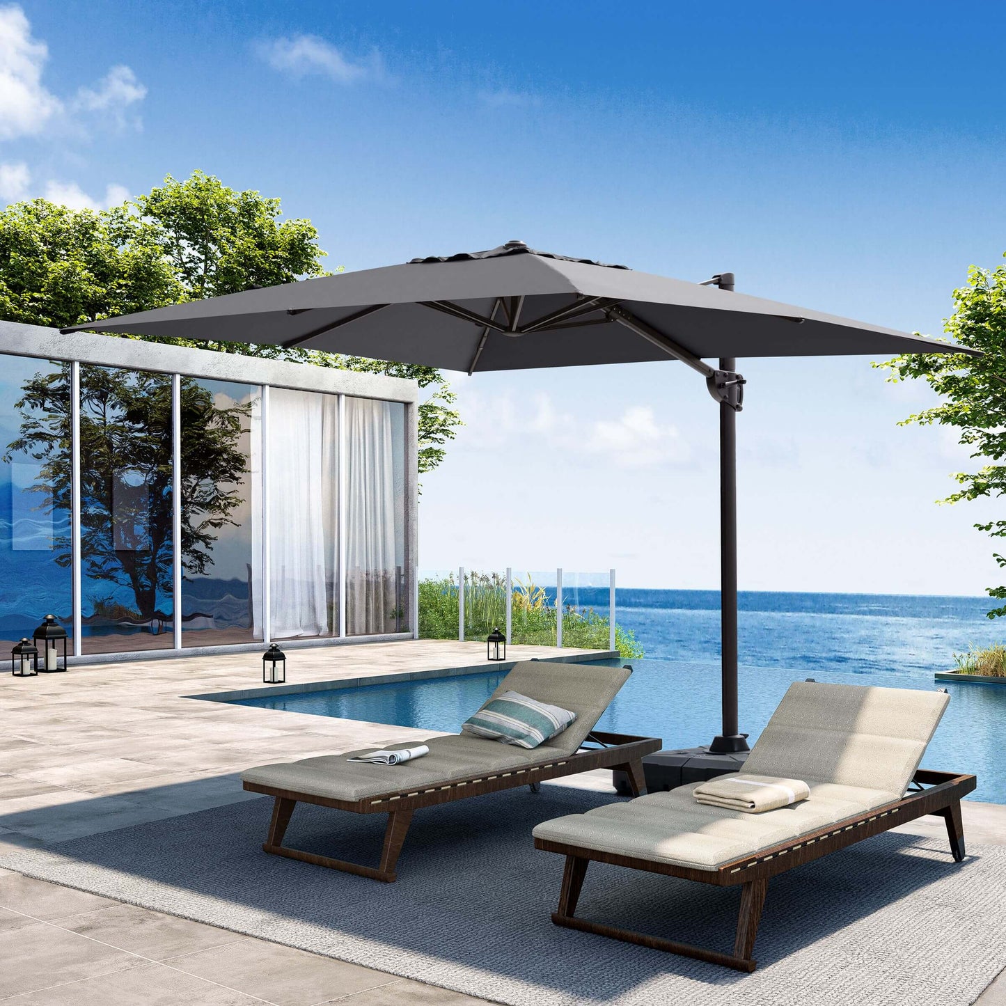 Grey rectangular cantilever patio umbrella shading poolside lounge chairs.