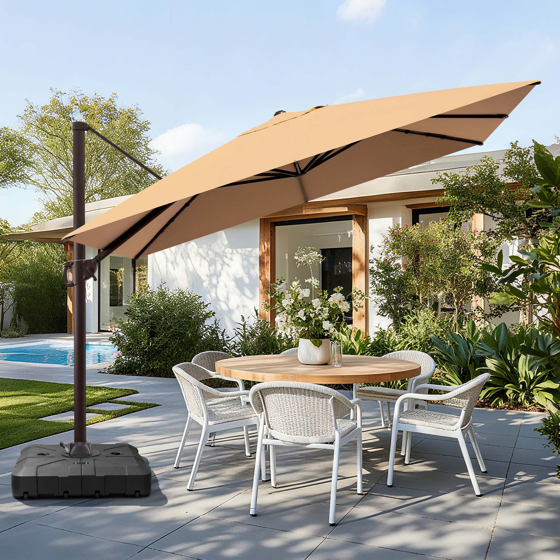Beige rectangular cantilever umbrella with weighted base over patio dining set.