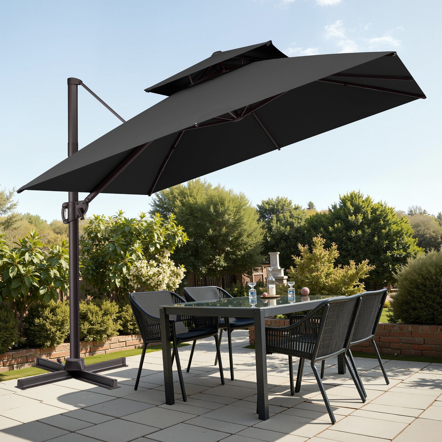 Tilted 10x10 ft square black cantilever patio umbrella with steel cross base shading a patio dining set