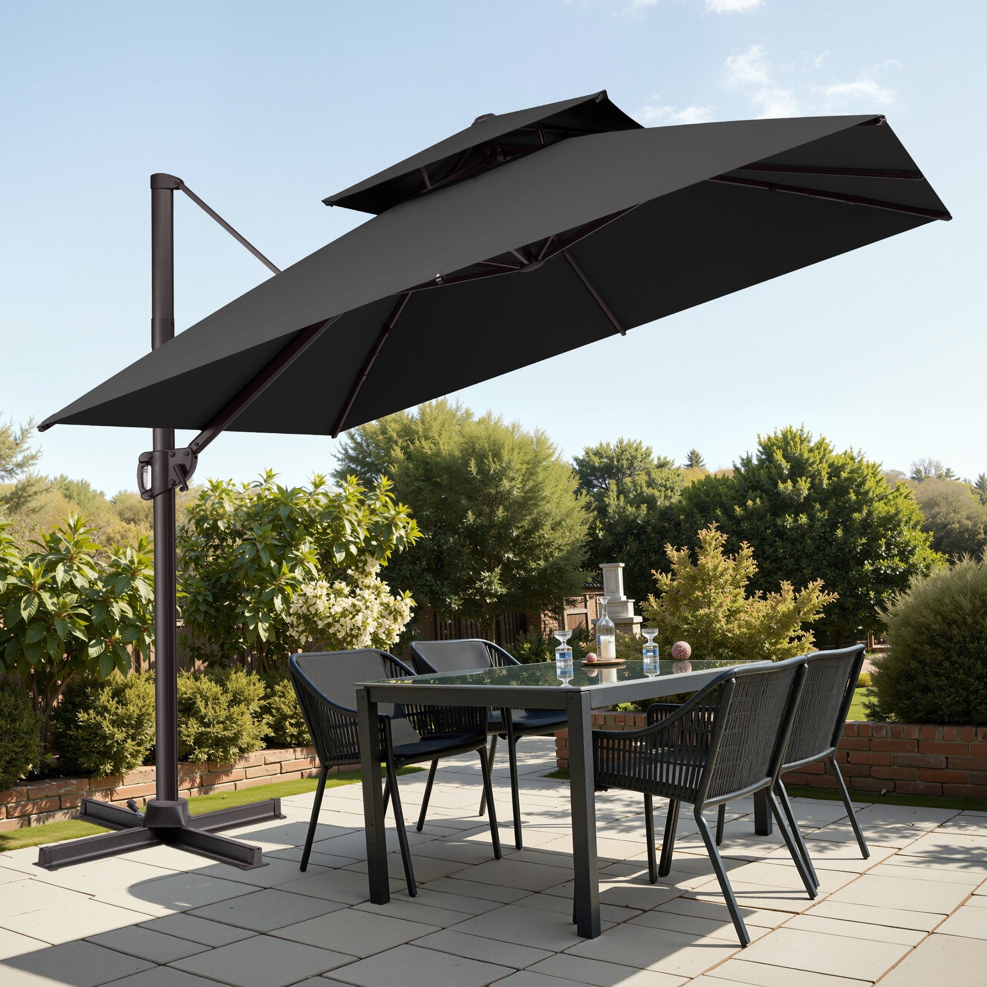 Tilted 10x10 ft square black cantilever patio umbrella with steel cross base shading a patio dining set