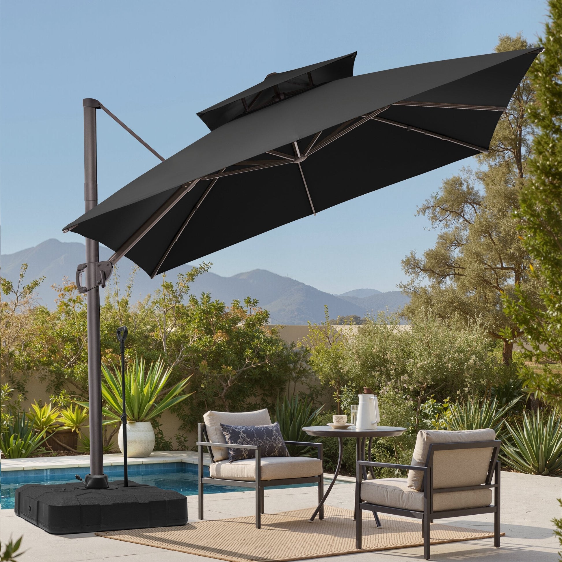 ilted 10x10 ft square black cantilever patio umbrella with wheeled base shading a poolside dining set