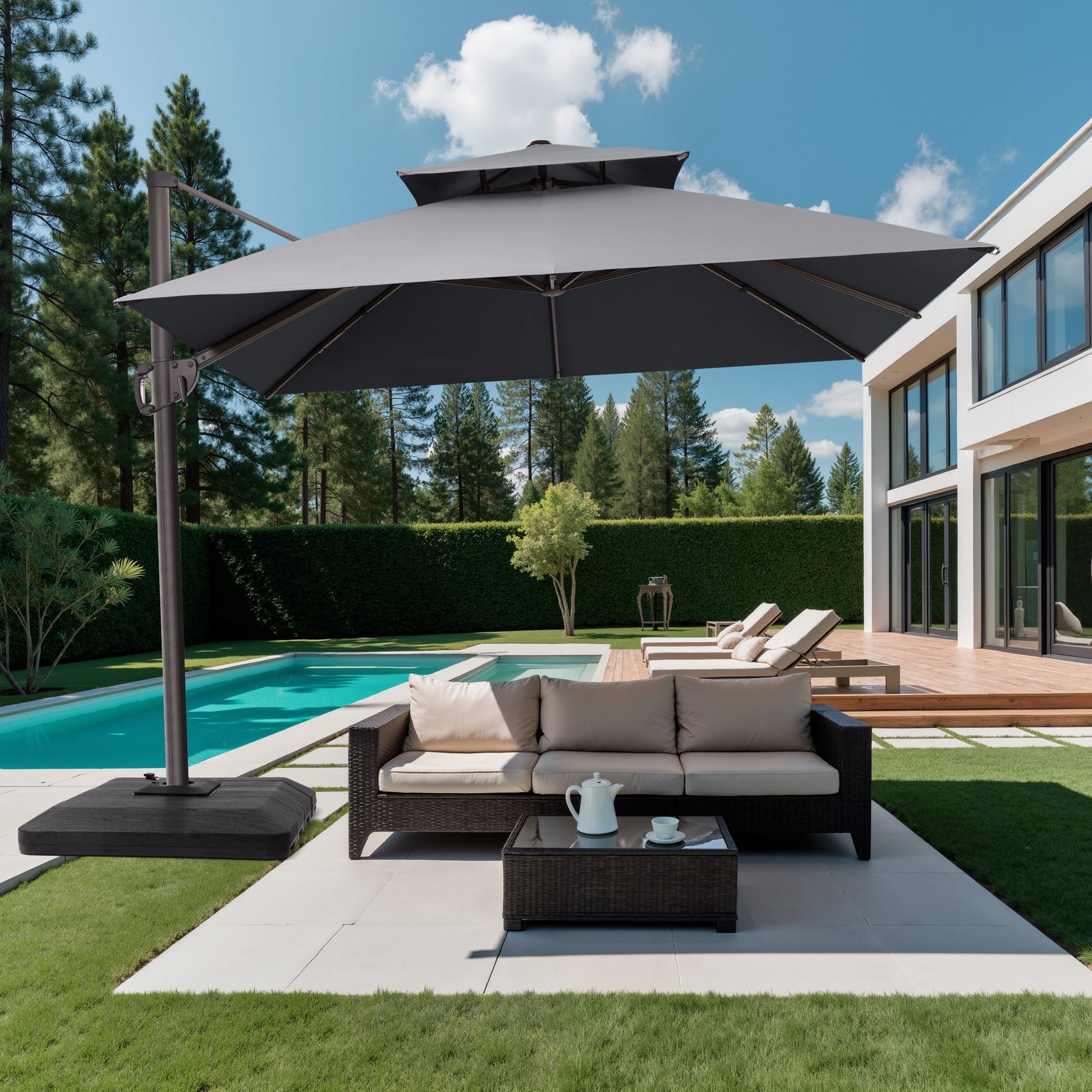 10x10 ft square grey cantilever umbrella with low-profile base shading a patio sofa set at a modern villa poolside