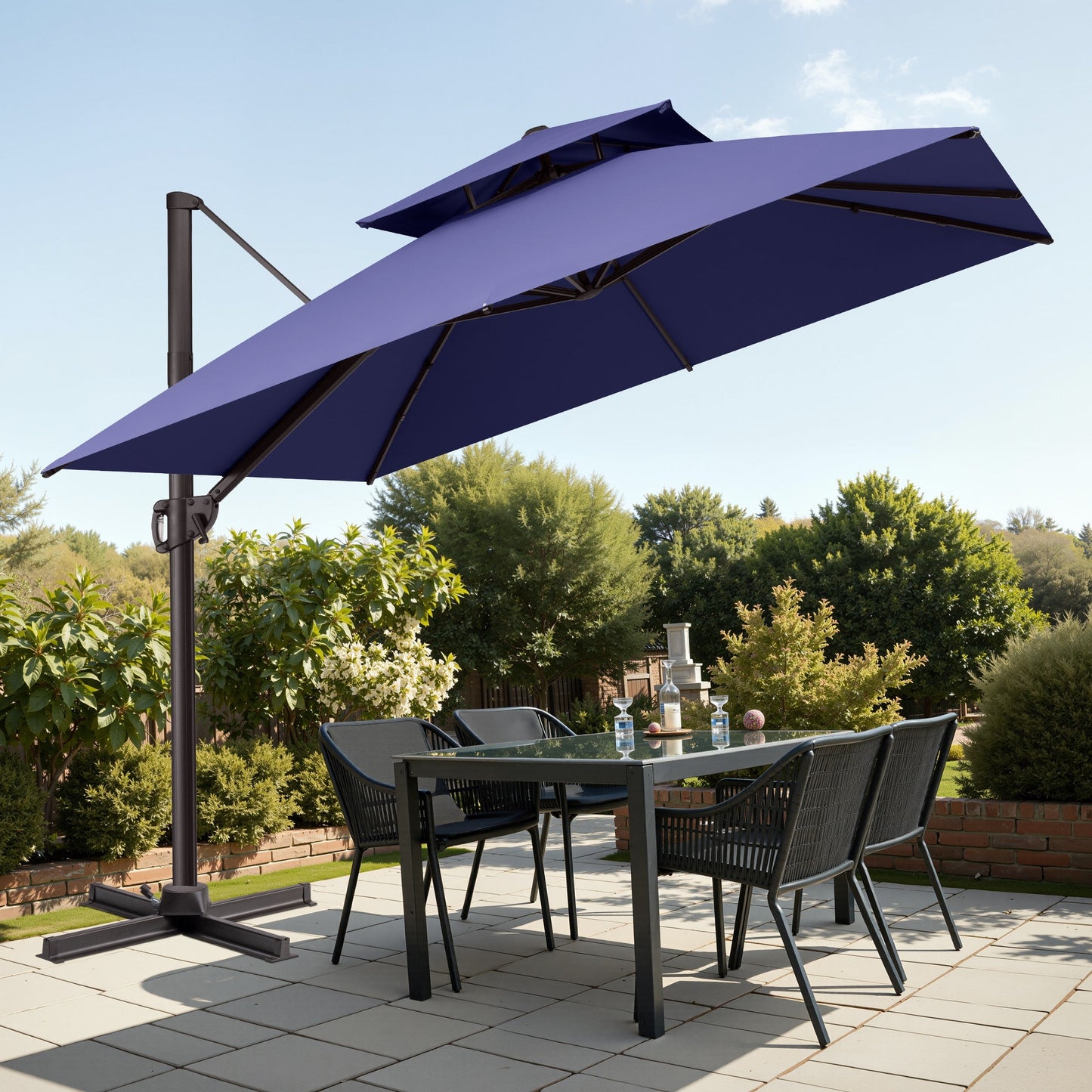 Tilted 10x10 ft square navy blue cantilever patio umbrella with steel cross base shading a patio dining set