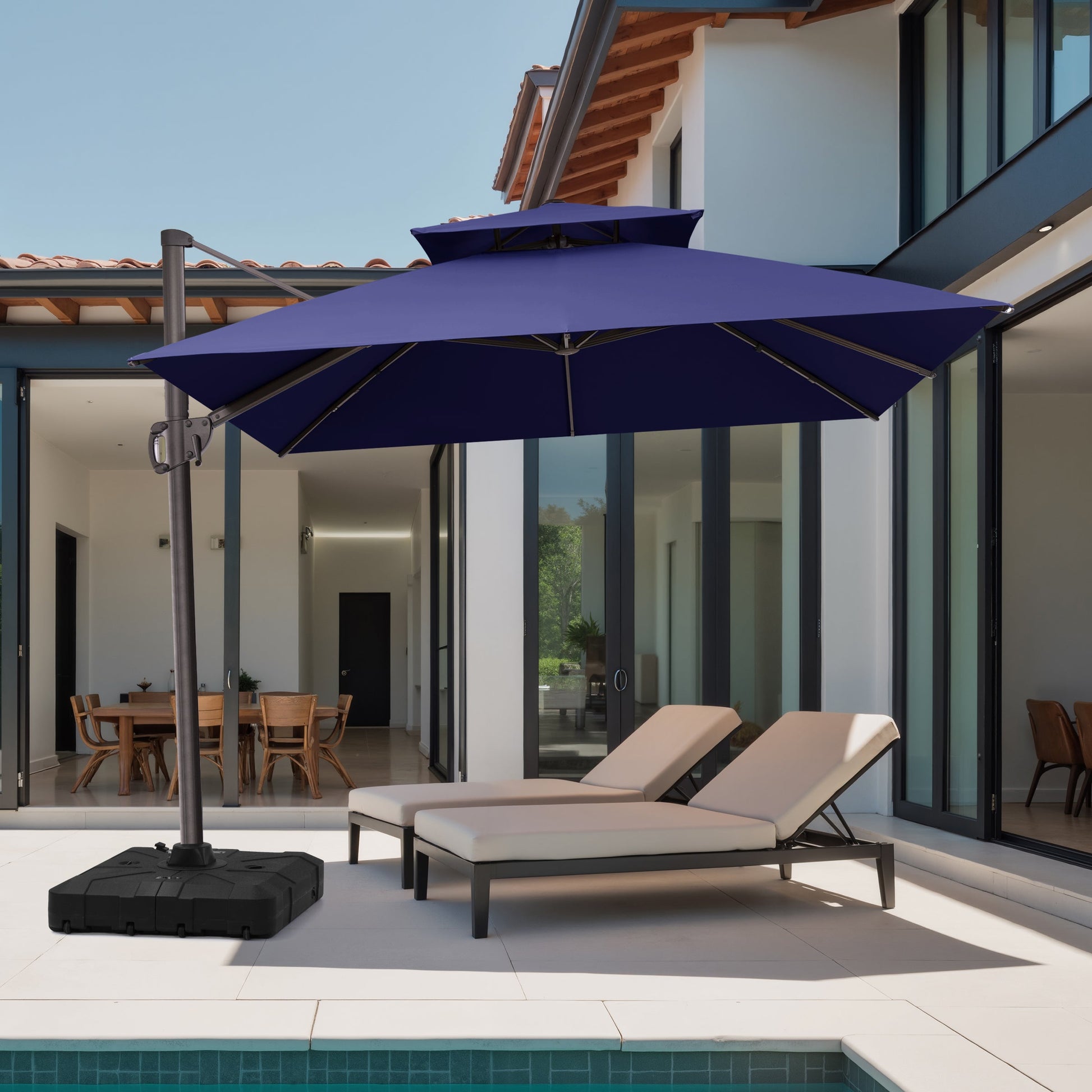 10x10 ft square navy blue cantilever umbrella with heavy-duty base shading chaise lounge chairs at a modern villa poolside