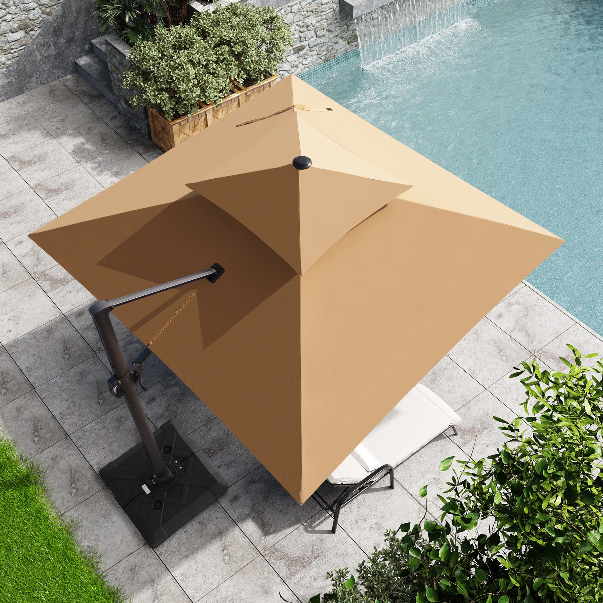 Top-down view of Crestlive 10x10 ft square beige cantilever patio umbrella with heavy-duty base shading a poolside lounge chair