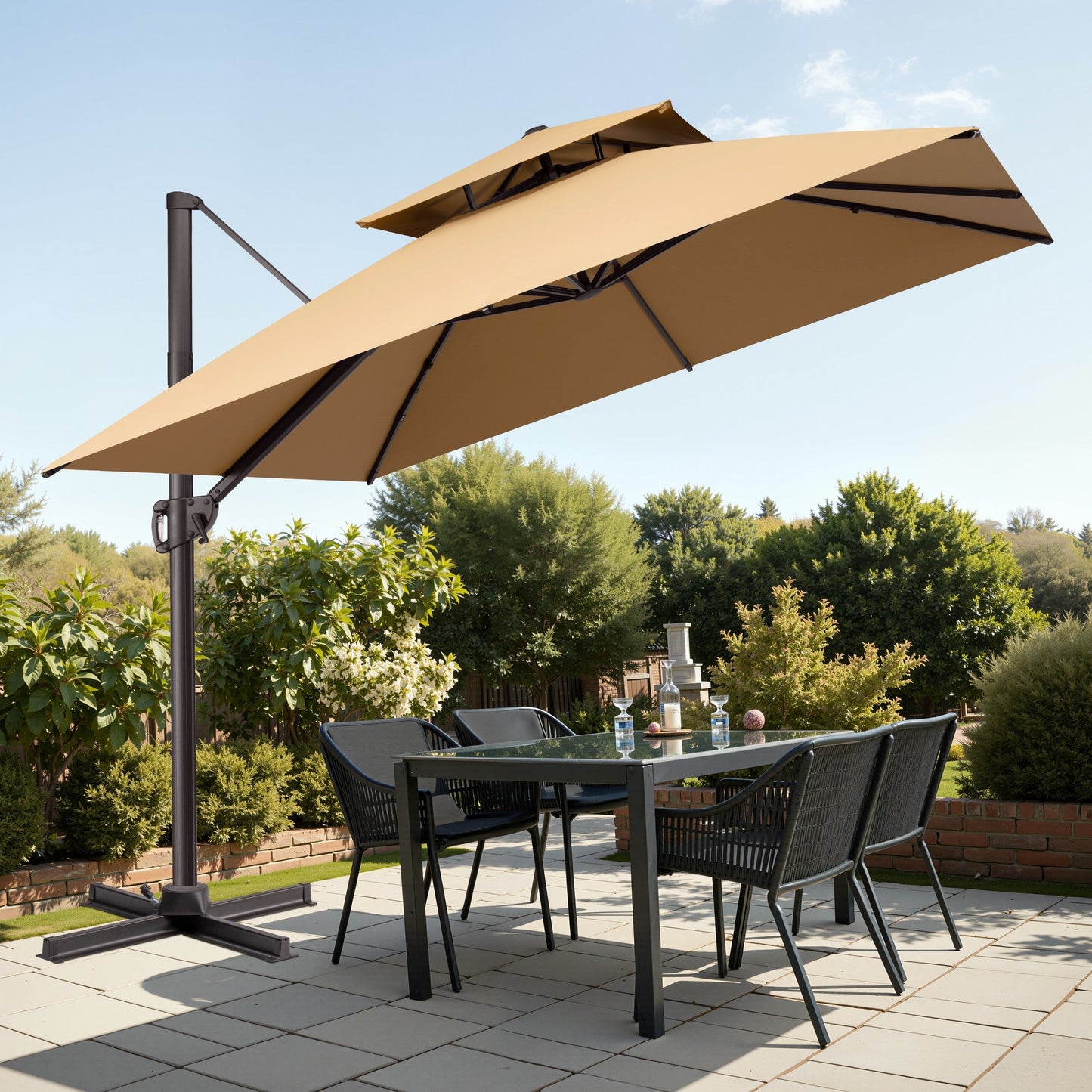 Tilted 10x10 ft square beige cantilever umbrella with steel cross base shading a outdoor patio dining set