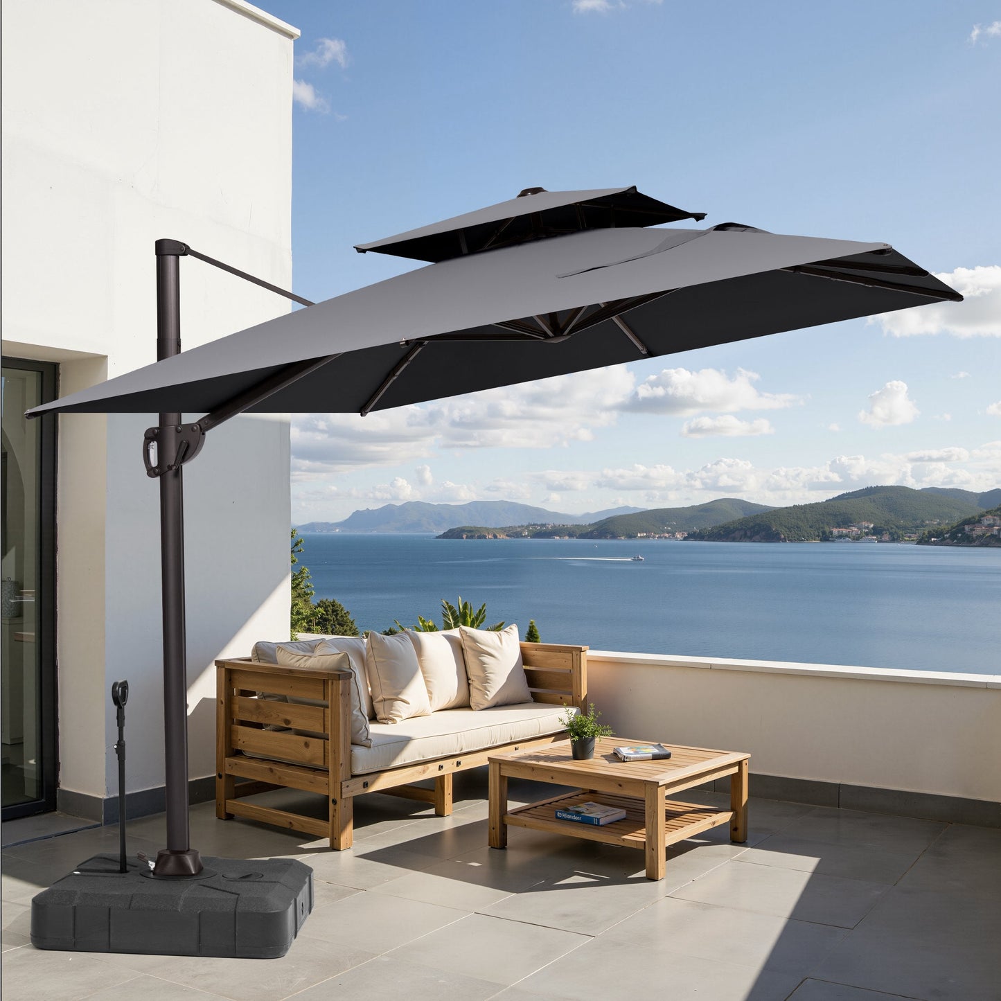 Crestlive 11x9 ft grey cantilever umbrella with wheeled base shading a wooden patio furniture sofa set on a coastal deck