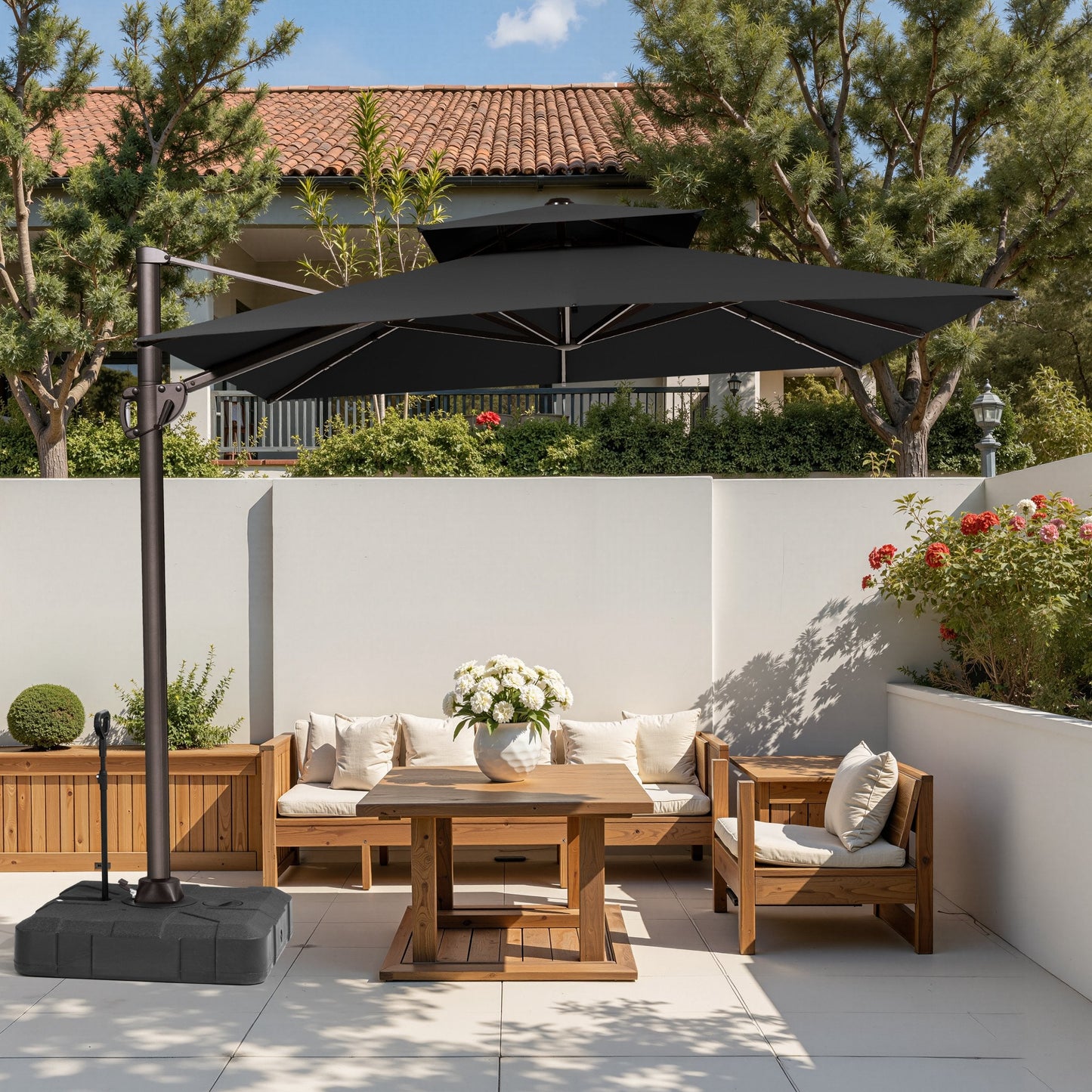 Crestlive 11x9 ft black cantilever umbrella with wheeled base shading a wooden patio conversation sofa set