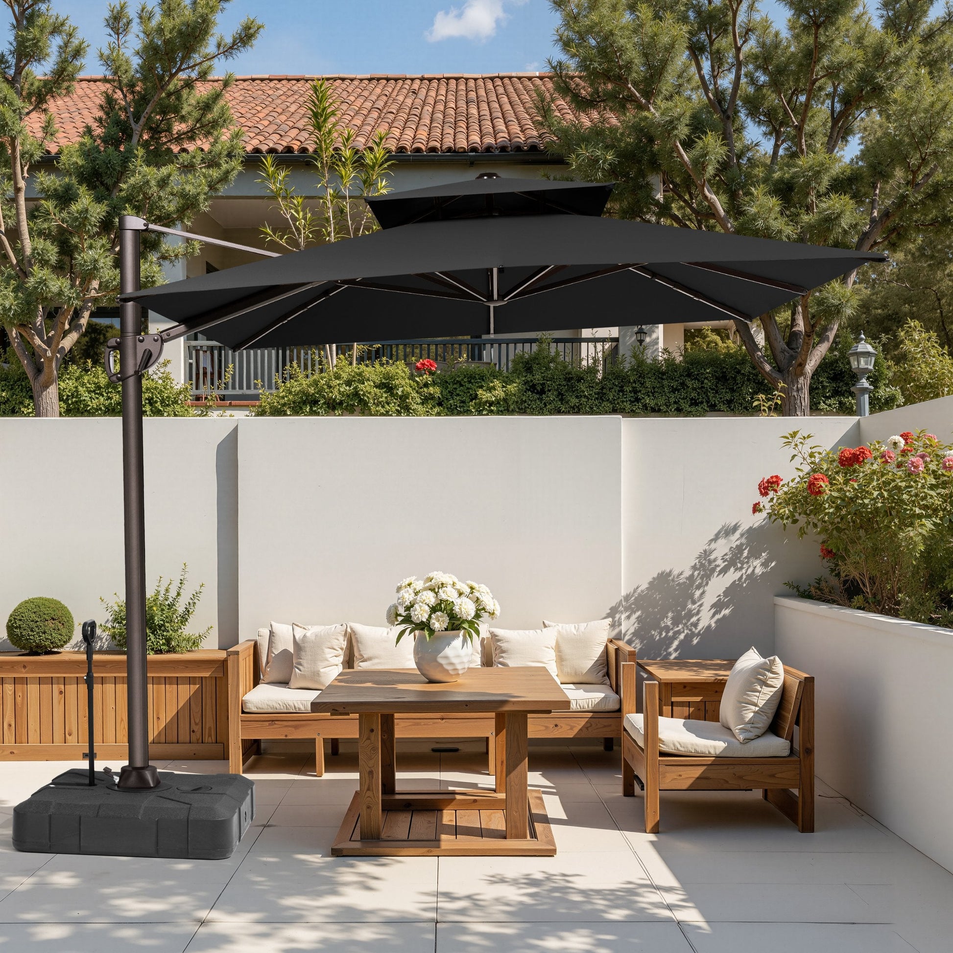 Crestlive 11x9 ft black cantilever umbrella with wheeled base shading a wooden patio conversation sofa set