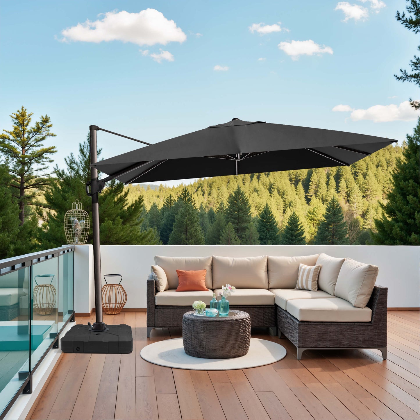 Black rectangular cantilever umbrella with base over patio sofa.