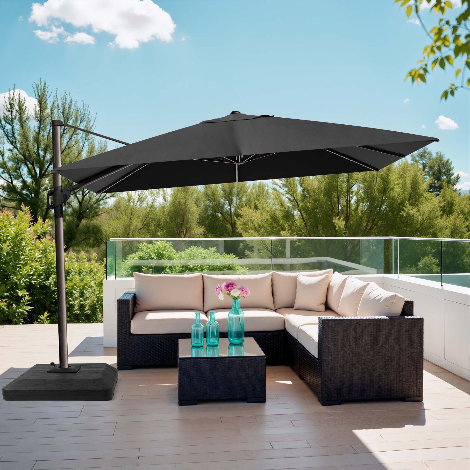 Black rectangular cantilever umbrella with weighted base over patio sofa.