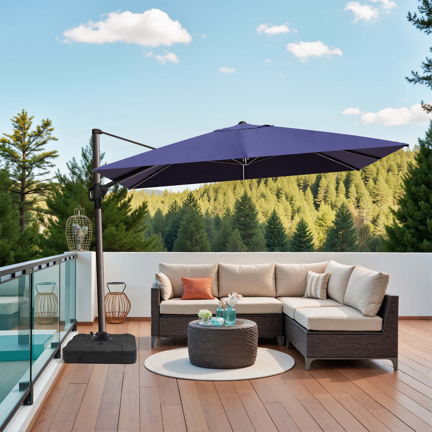 Navy blue rectangular cantilever umbrella with weighted base over patio sofa.