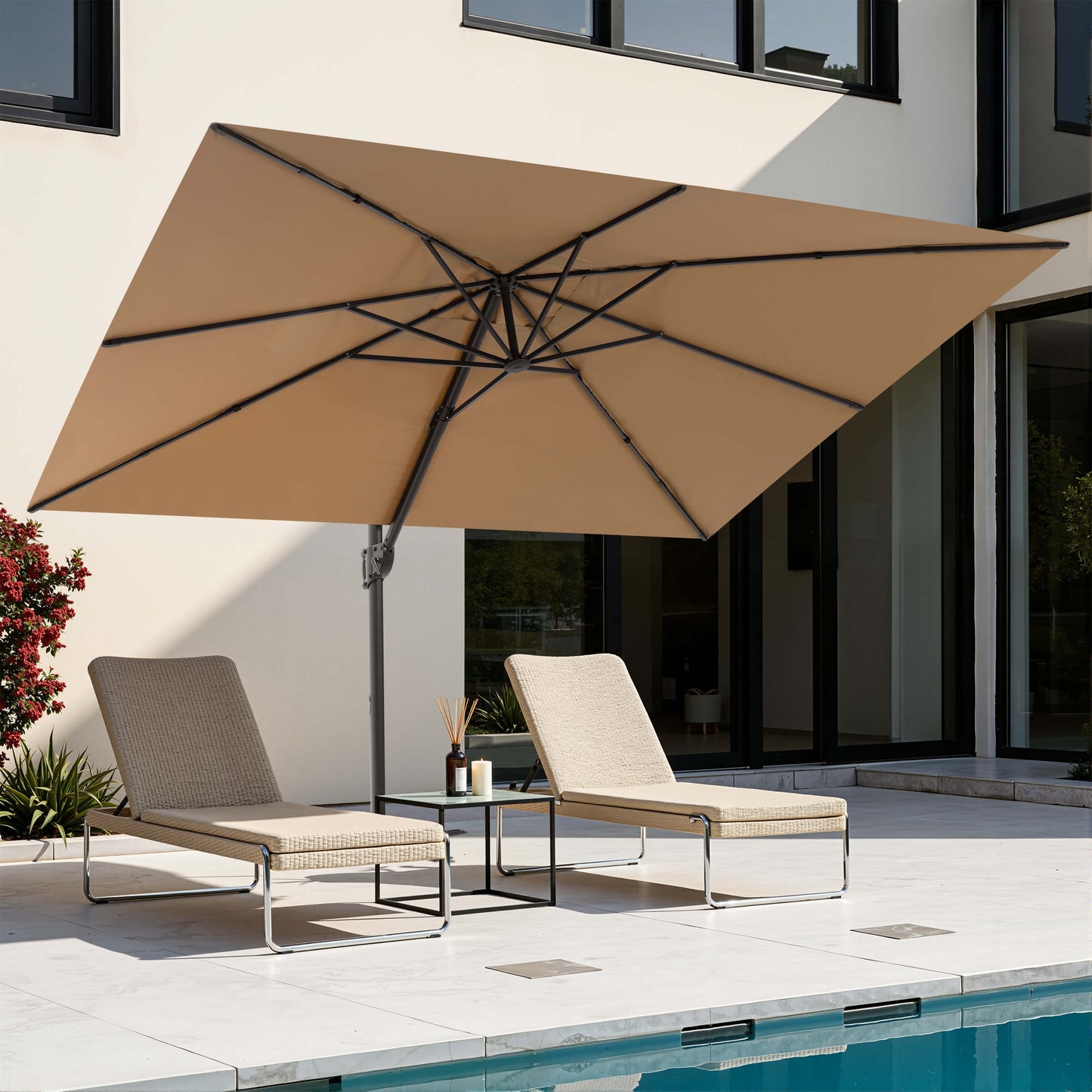 Khaki rectangular cantilever patio umbrella over poolside lounge chairs.