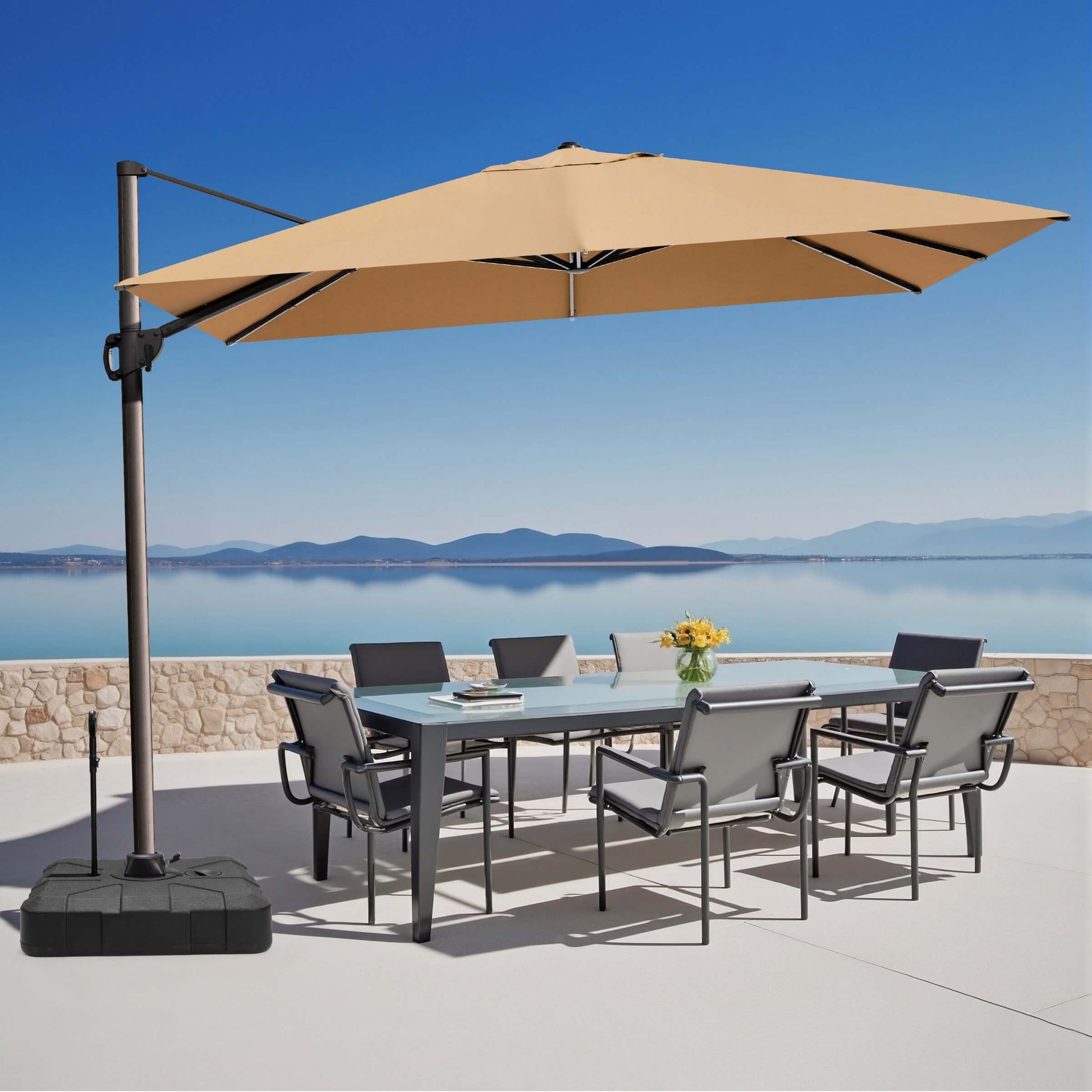 Khaki rectangular cantilever umbrella with pull-rod base over outdoor dining set.