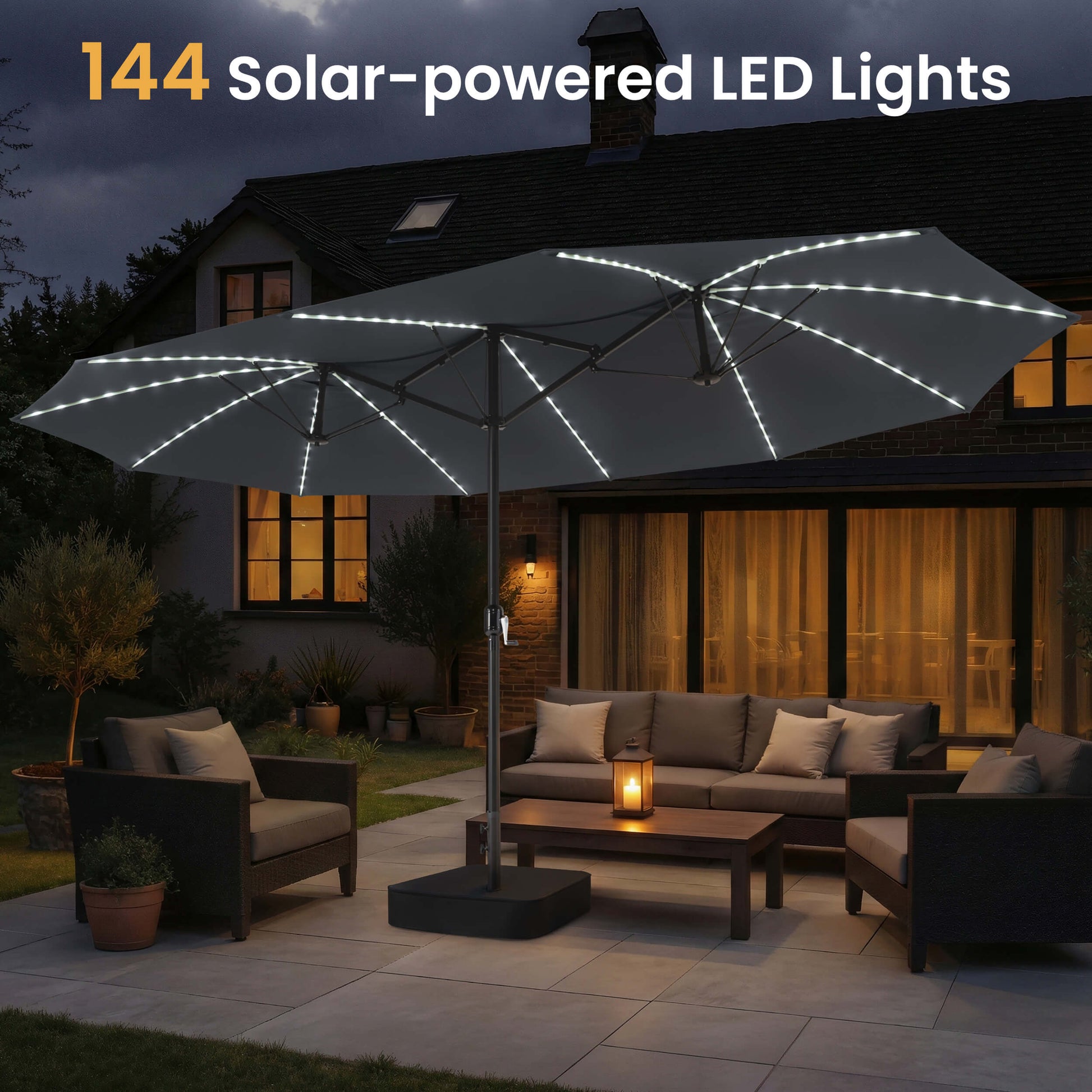 15x9 ft dark grey double-sided umbrella with 144 solar-powered LED lights shading a patio sofa set at night.