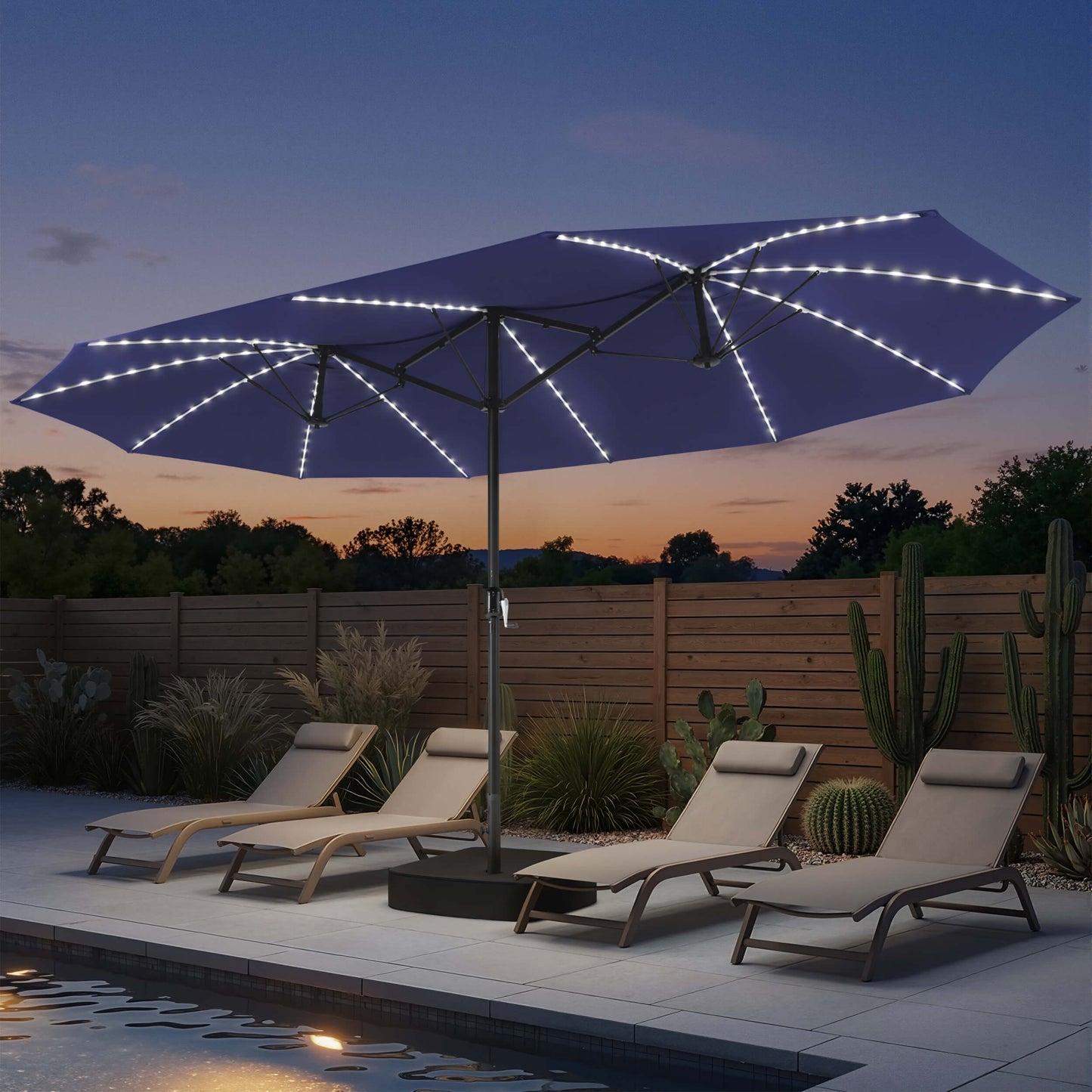 15x9 ft navy double-sided market umbrella with solar LED lights shading poolside chaise lounges at night.
