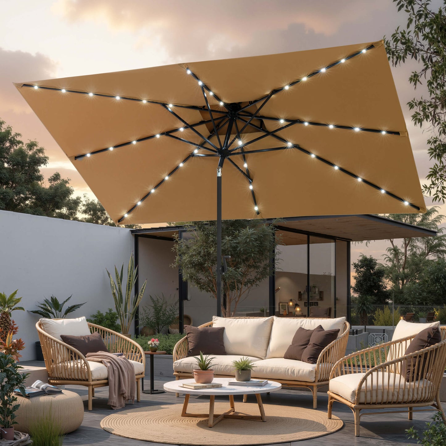 10x7 ft beige market umbrella with solar LED lights shading a backyard patio sofa set at night.
