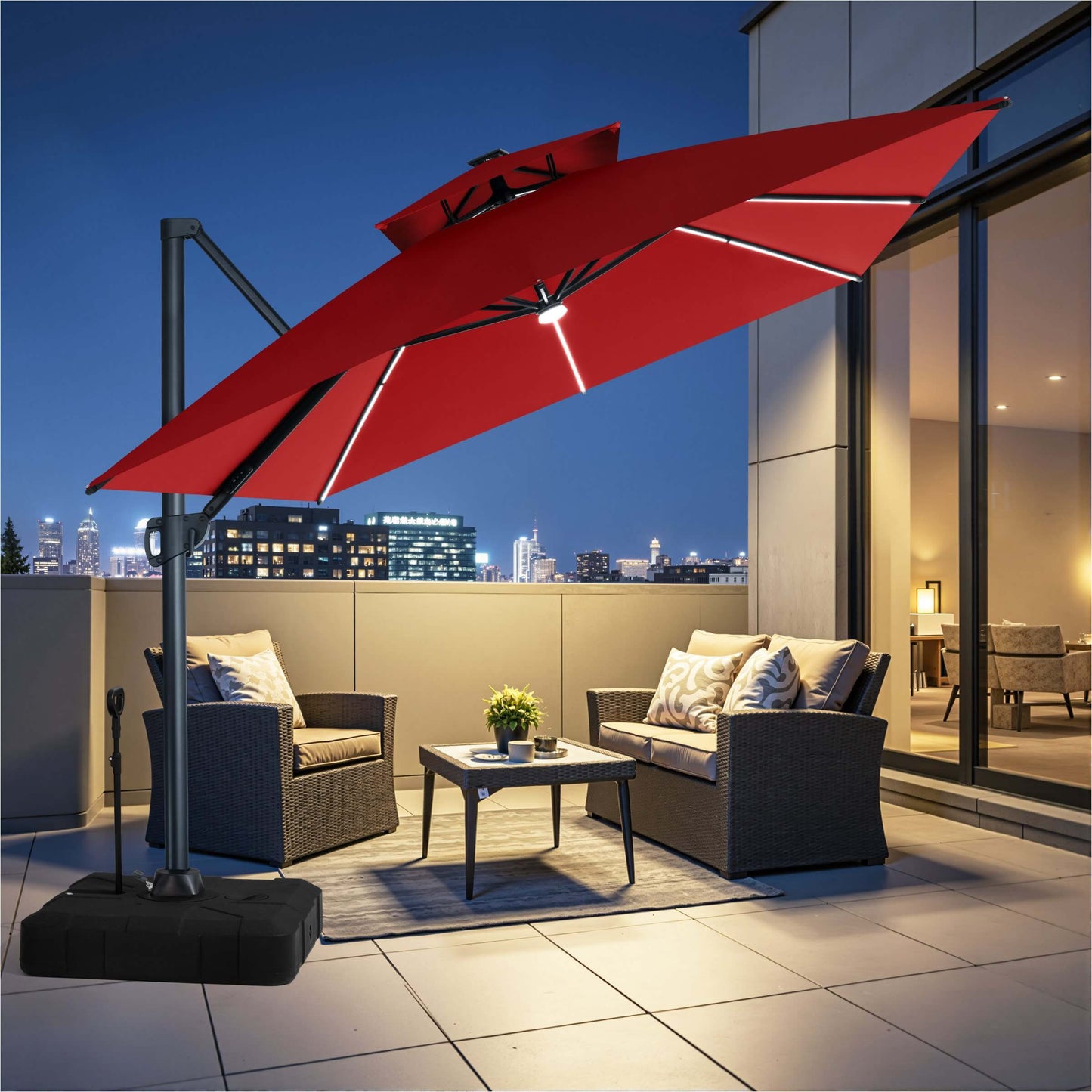 Large red square double-top LED cantilever umbrella with wheeled rolling base illuminating a rooftop terrace area.