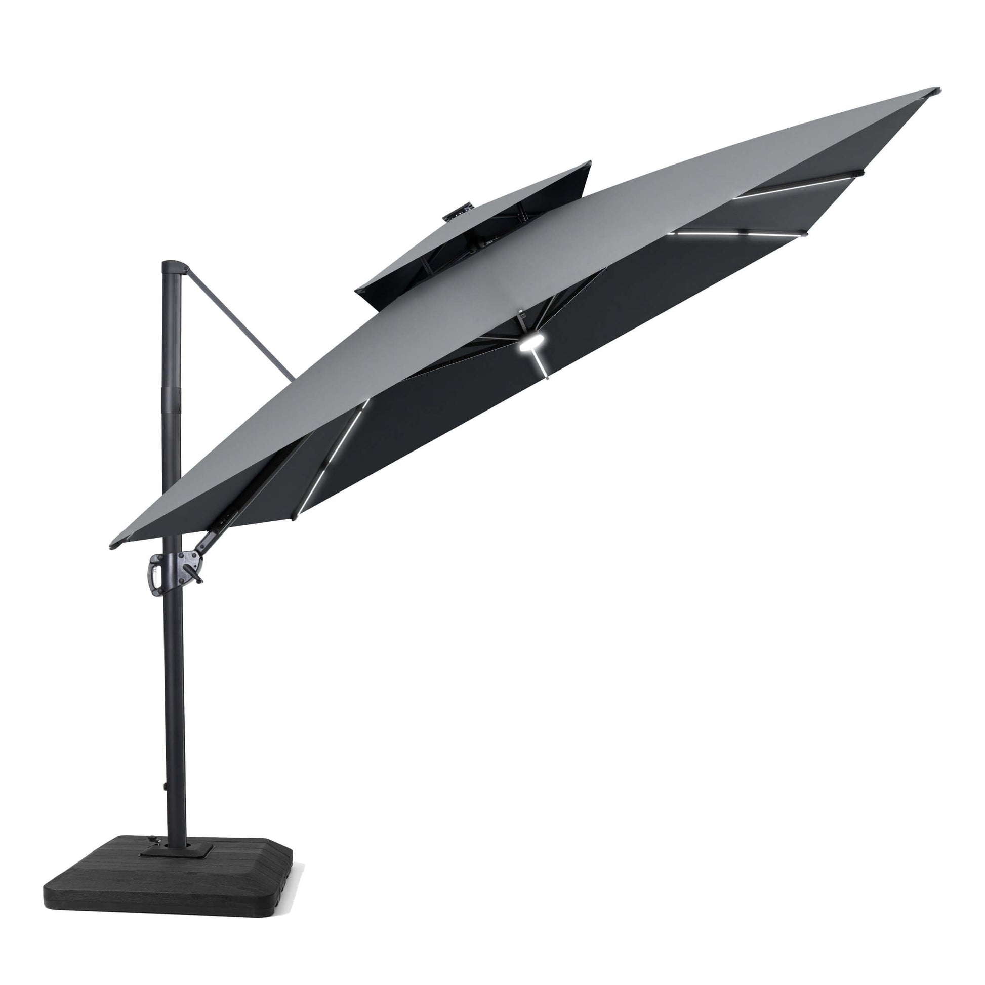 Tilted grey LED cantilever umbrella on a weighted base.