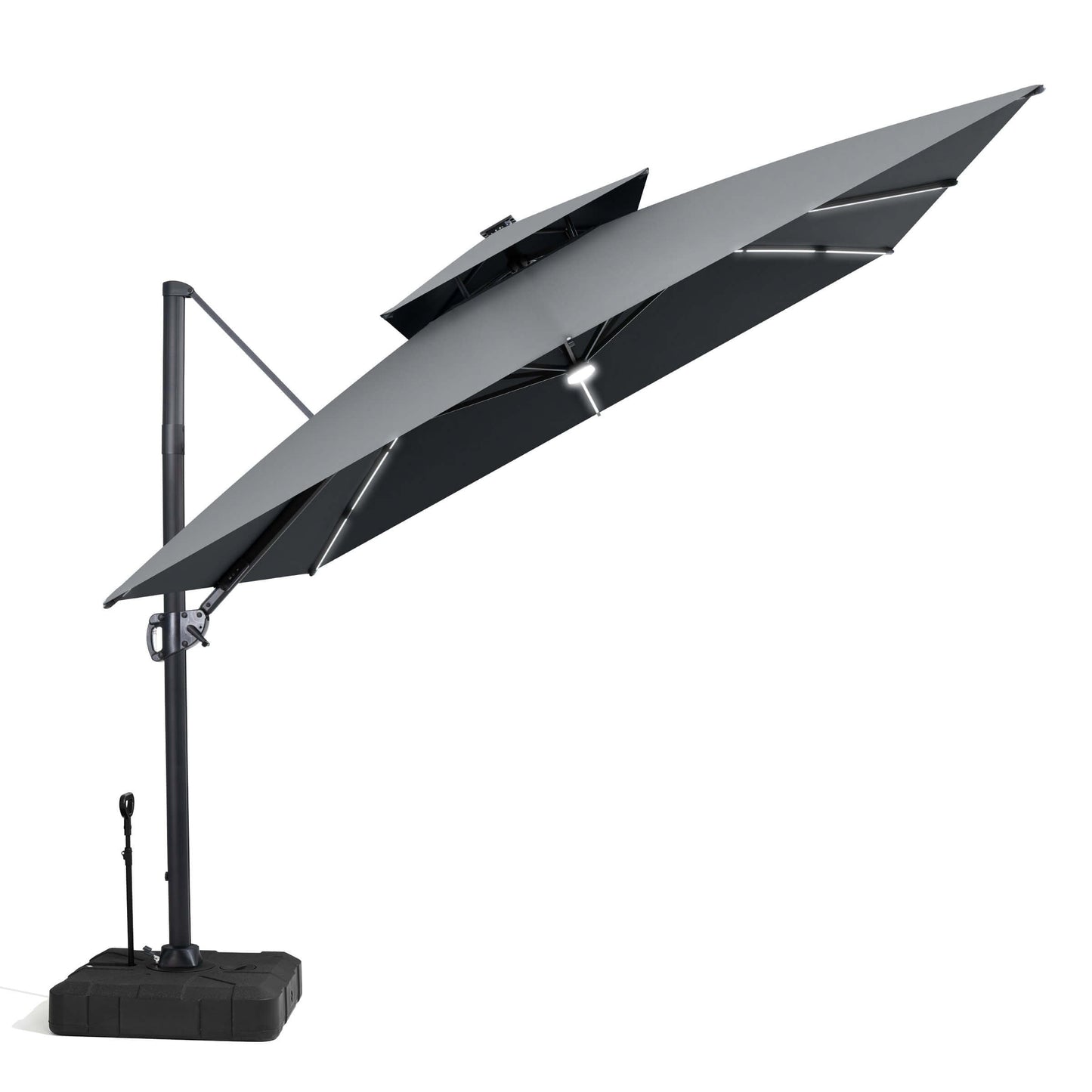 Tilted grey LED cantilever patio umbrella with base.
