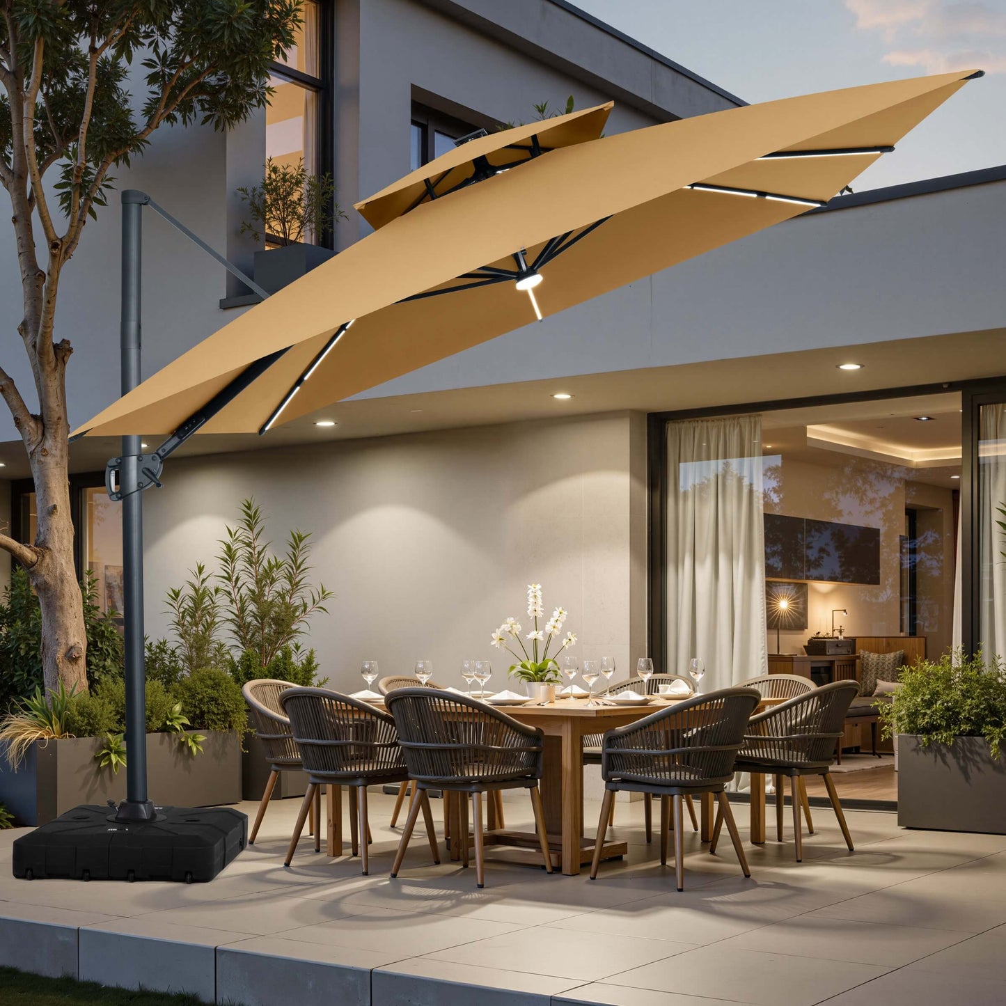 Khaki cantilever patio umbrella with LED lights over a dining set on a modern terrace at dusk.