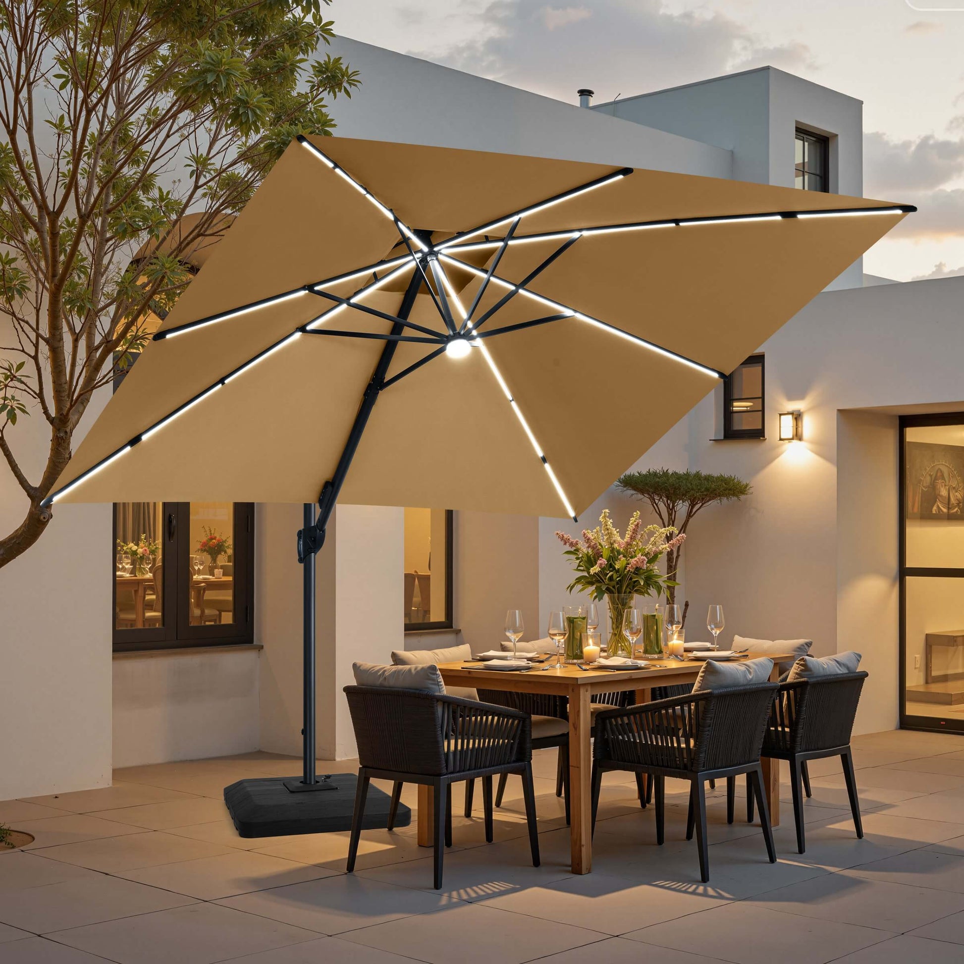 Beige LED cantilever umbrella with weighted base over a patio dining set.