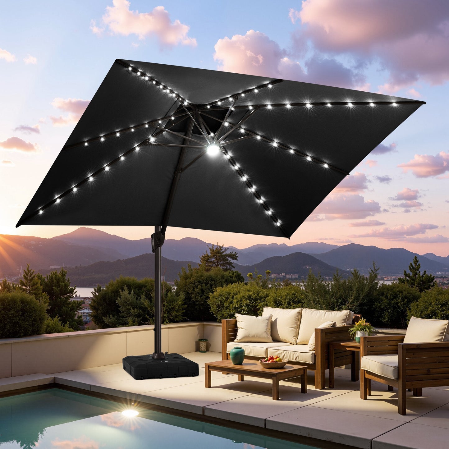 Crestlive black cantilever umbrella with LED lights illuminating a poolside patio lounge set at sunset