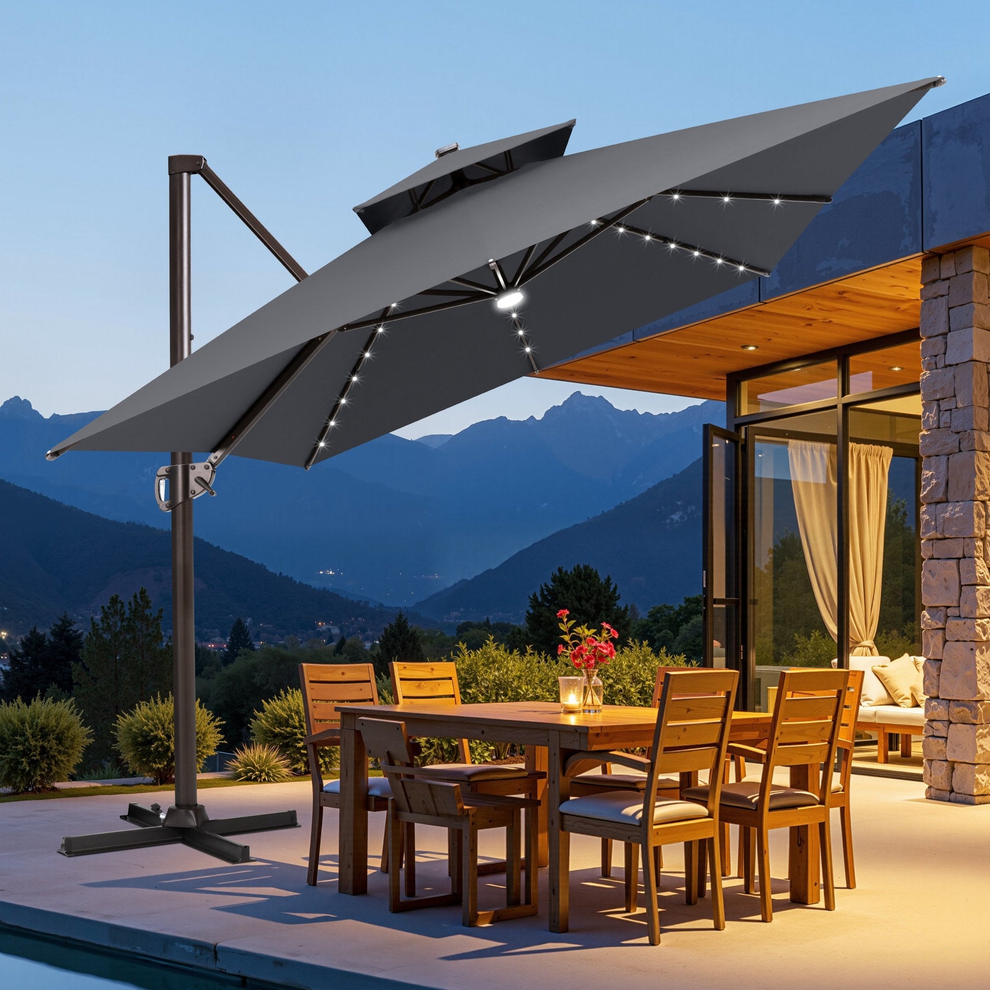 Crestlive tilted dark grey cantilever umbrella with cross base shading an outdoor wooden dining set at dusk