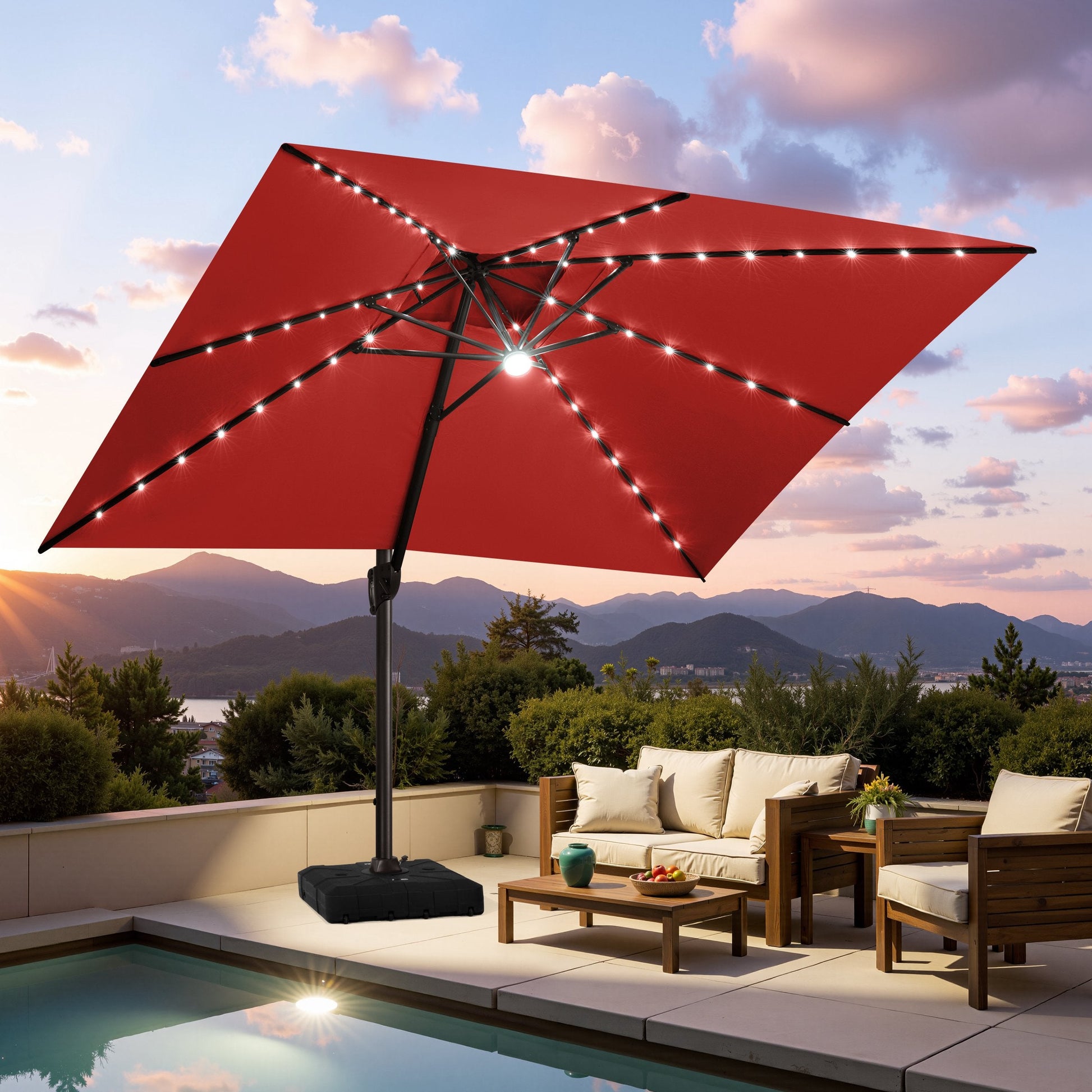 Crestlive red cantilever umbrella with LED lights shading a luxury poolside lounge set at sunset
