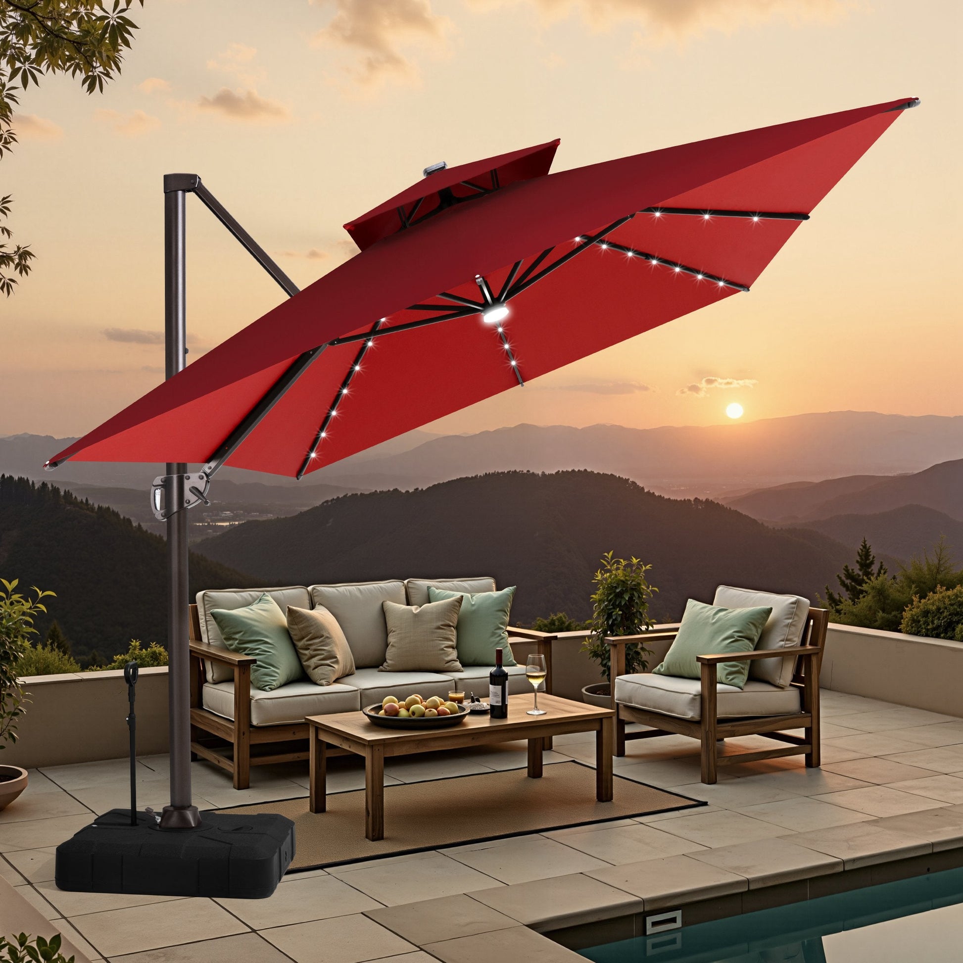 Crestlive tilted red cantilever umbrella with LED lights shading a mountain view poolside wooden lounge set at sunset