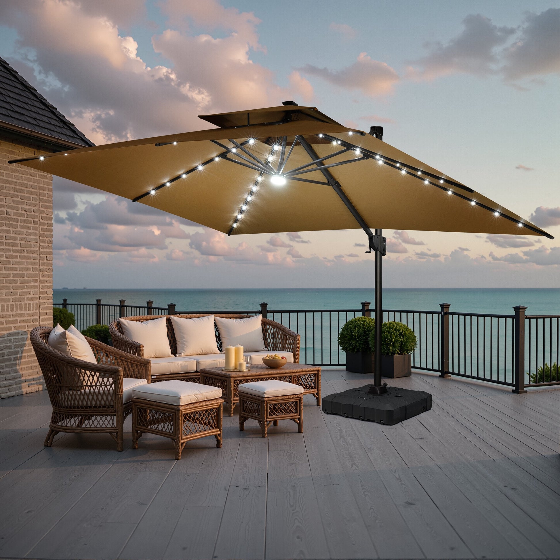 Crestlive large outdoor umbrella provides shade for a wicker patio conversation set on a coastal deck at sunset