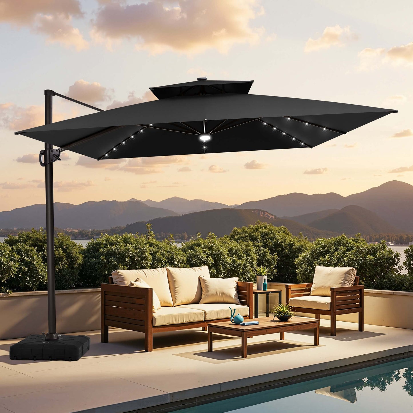 Black LED cantilever umbrella with wheeled base on suburban patio.
