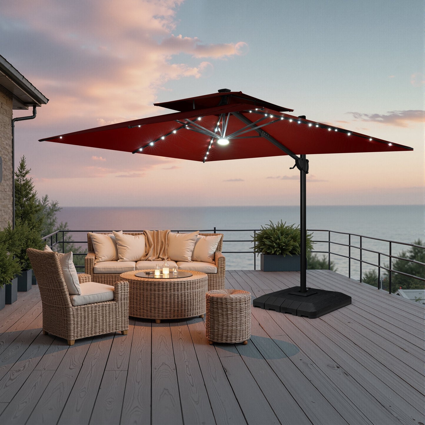 Lighted Crestlive 11x9 ft red cantilever umbrella with low-profile base shading a wicker patio set at sunset