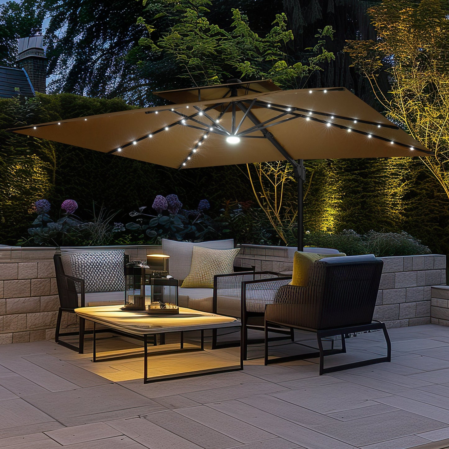 Crestlive 11x9 ft tan rectangular cantilever patio umbrella with solar LED lights shading a conversation set at night