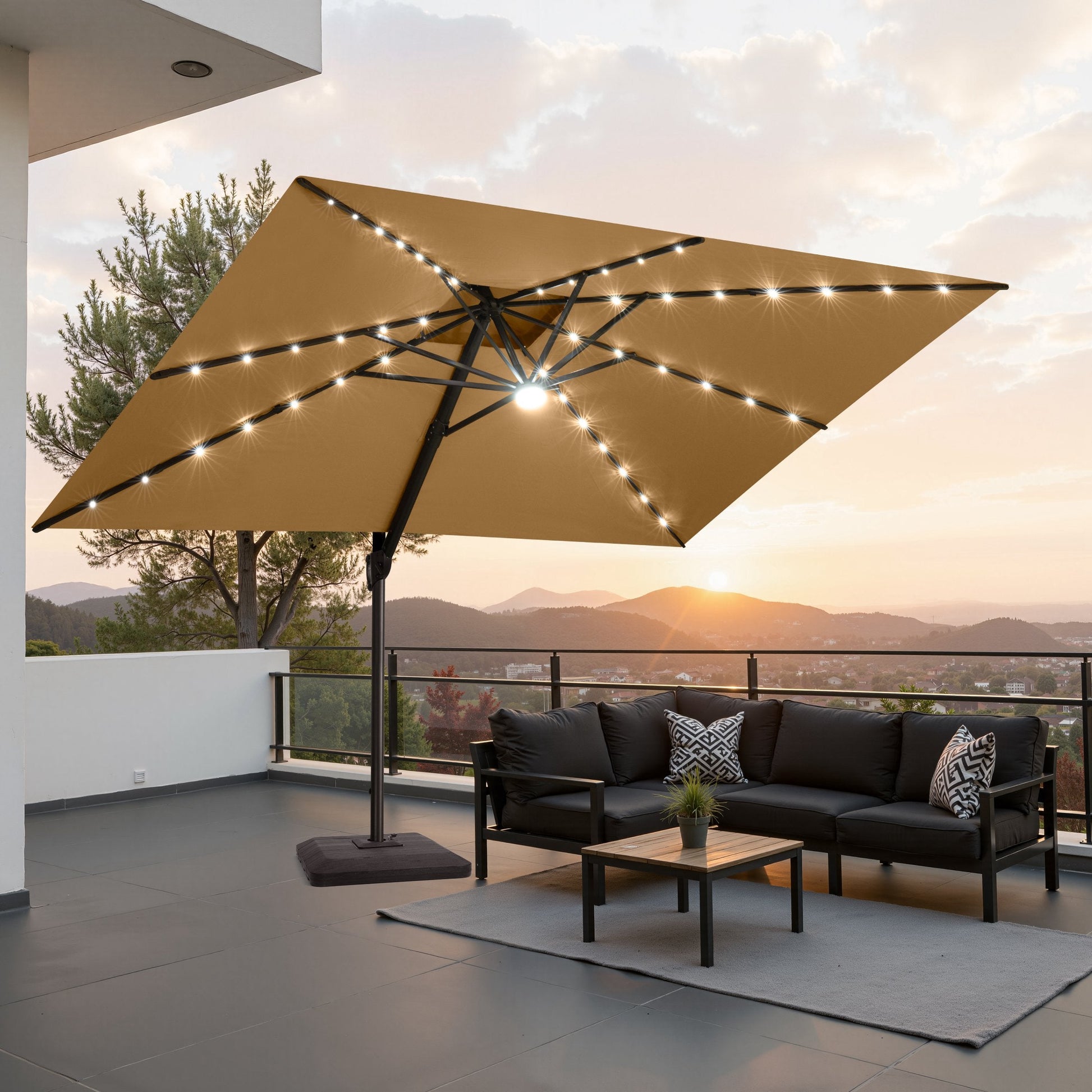 Lighted Crestlive 11x9 ft tan cantilever patio umbrella with LED lights shading a black sectional sofa at sunset