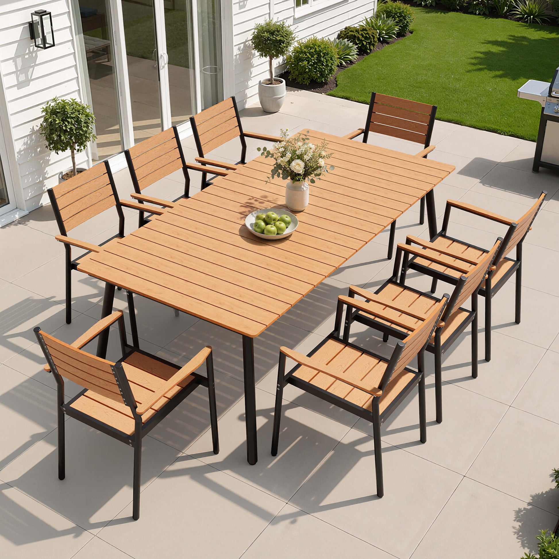 9-piece outdoor patio dining set with polywood table and 8 chairs in backyard setup.