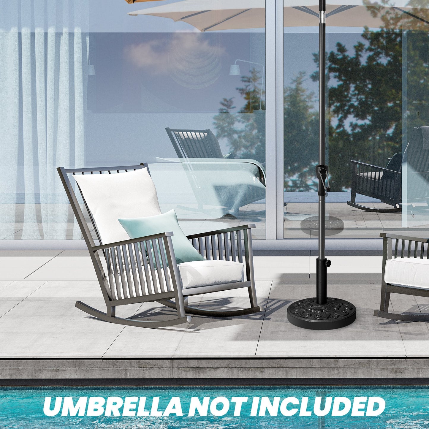 Black 30-46 lbs round floral cement umbrella base between rocking chairs on a poolside patio.