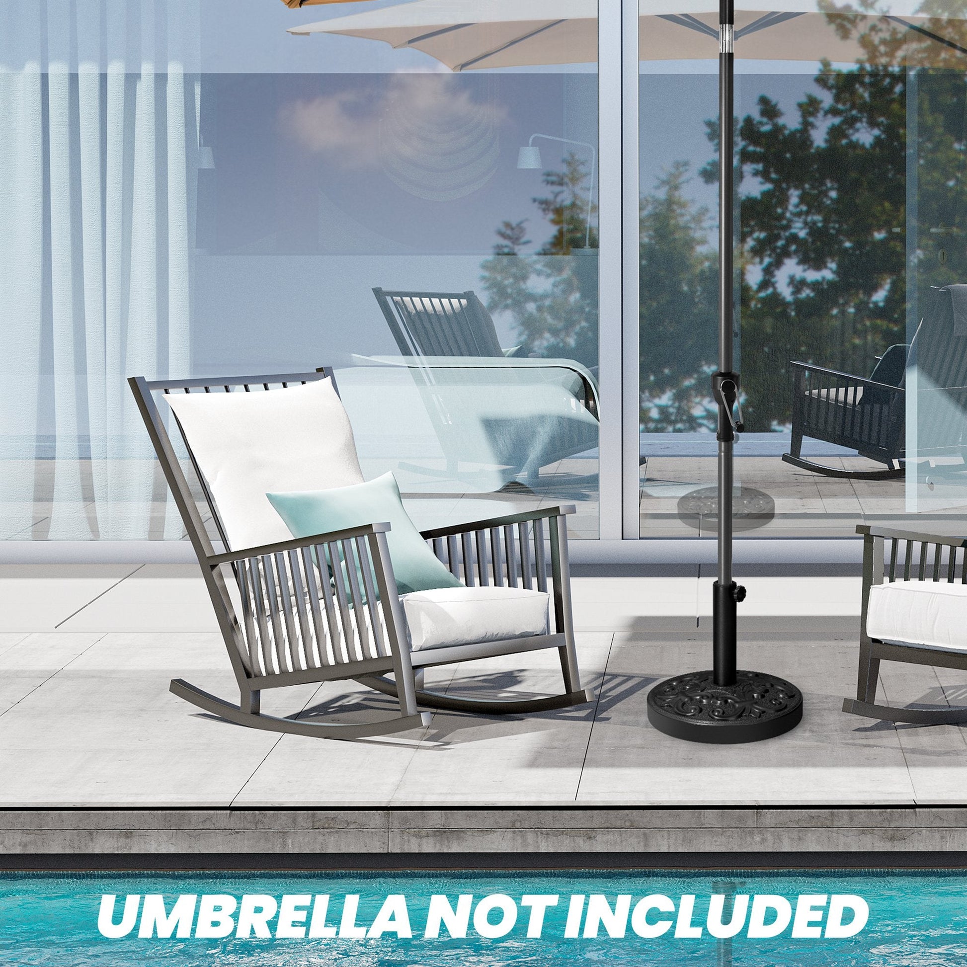 Black 30-46 lbs round floral cement umbrella base between rocking chairs on a poolside patio.
