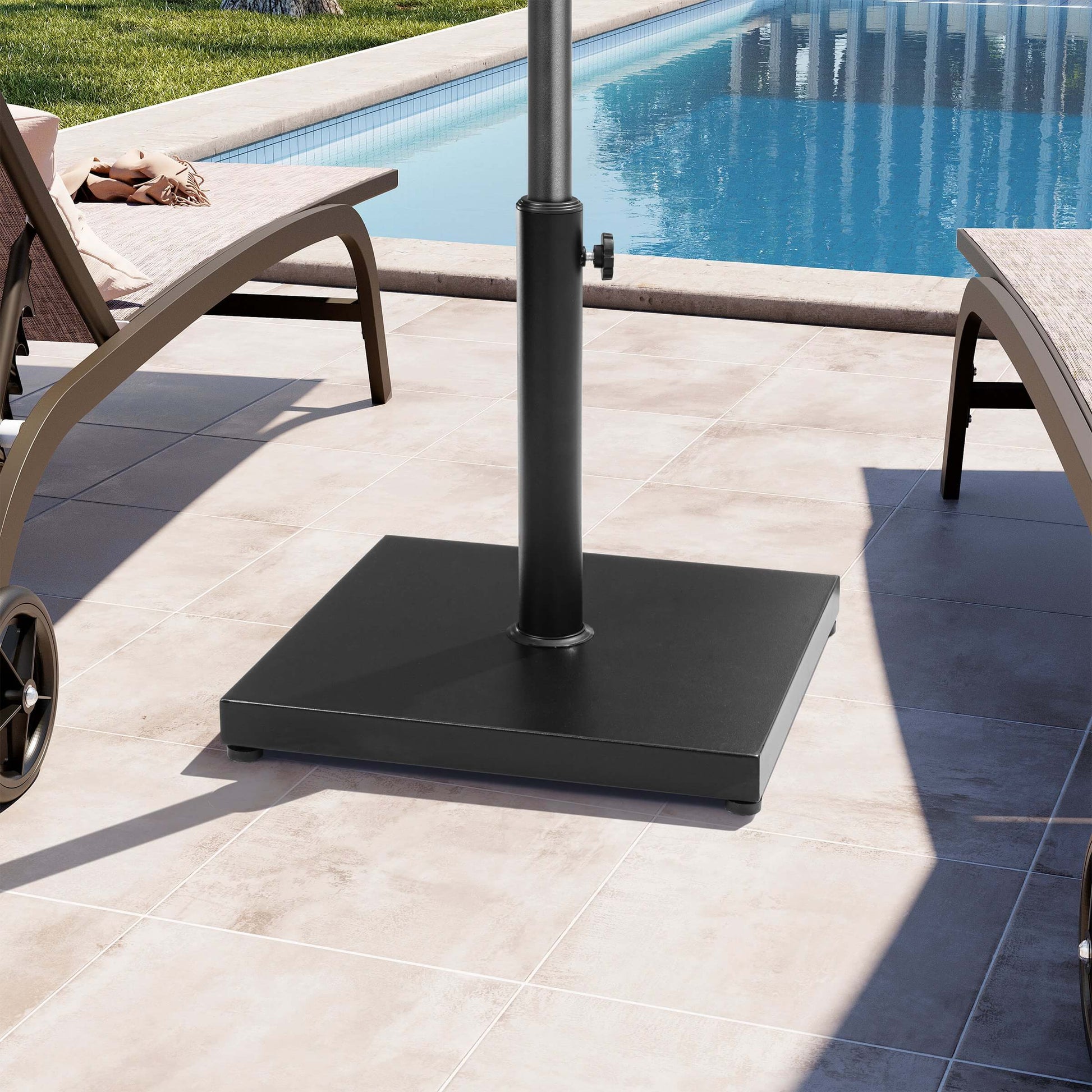 Black square weighted market umbrella base on poolside patio.