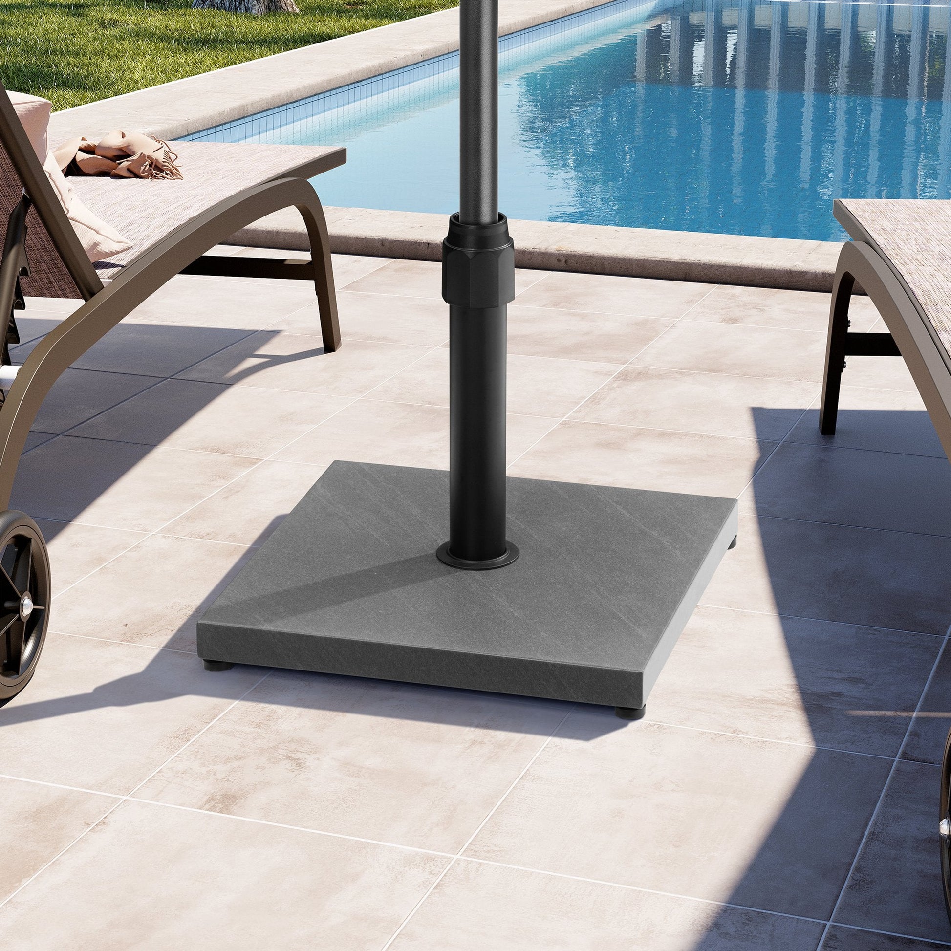 43 lbs square grey steel patio umbrella base on a poolside patio.