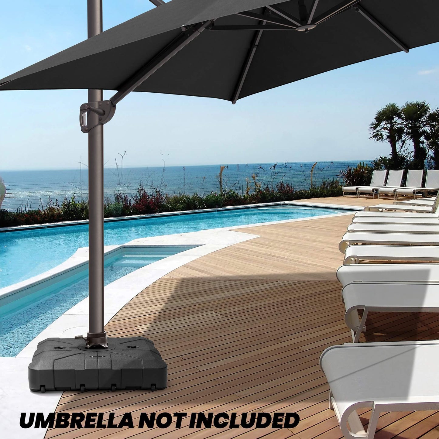 Black square fillable cantilever umbrella base with wheels on poolside deck. Umbrella not included.